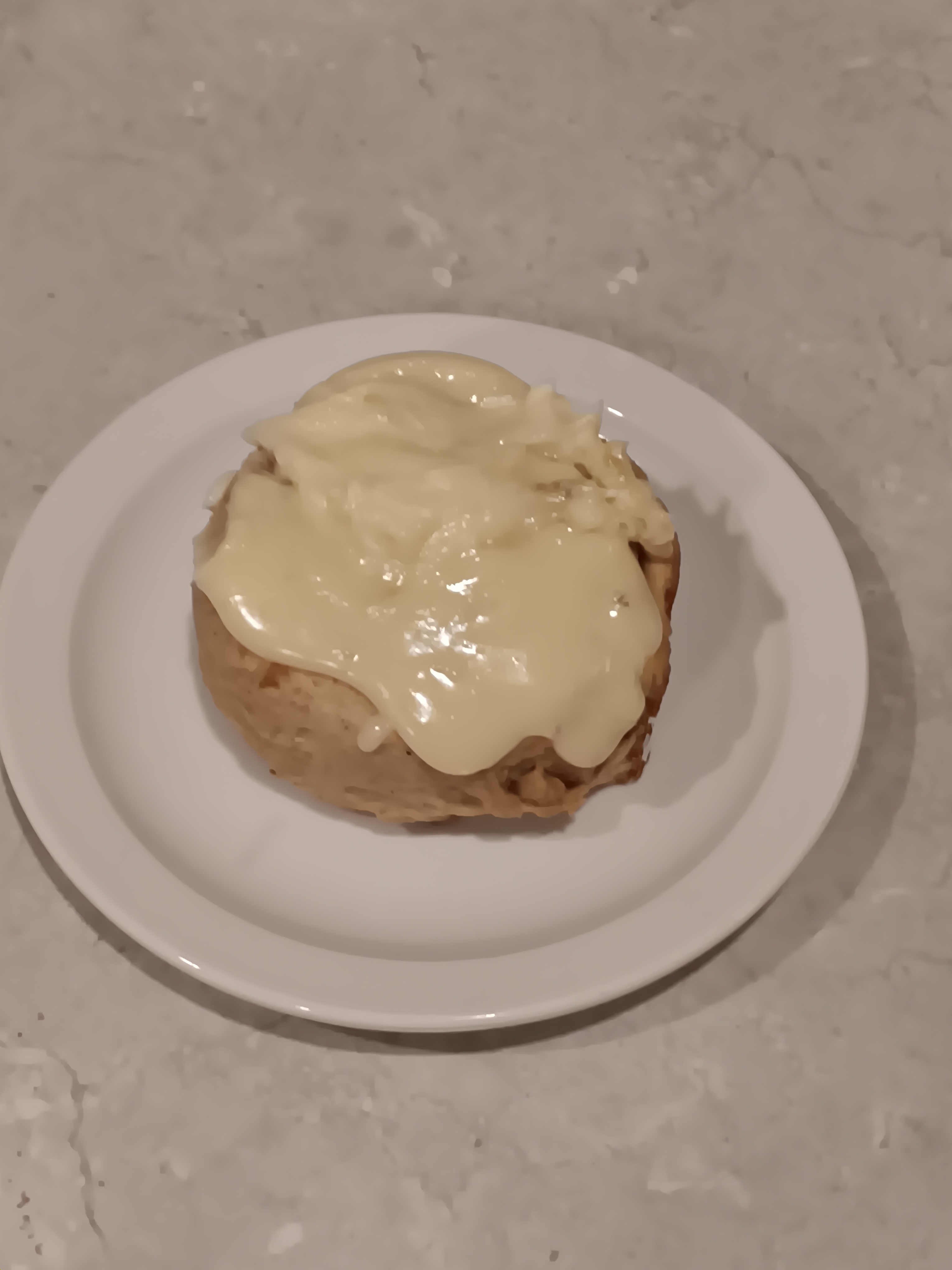 Indulge in Spice Brioche Rolls Topped with Decadent Mascarpone Frosting!