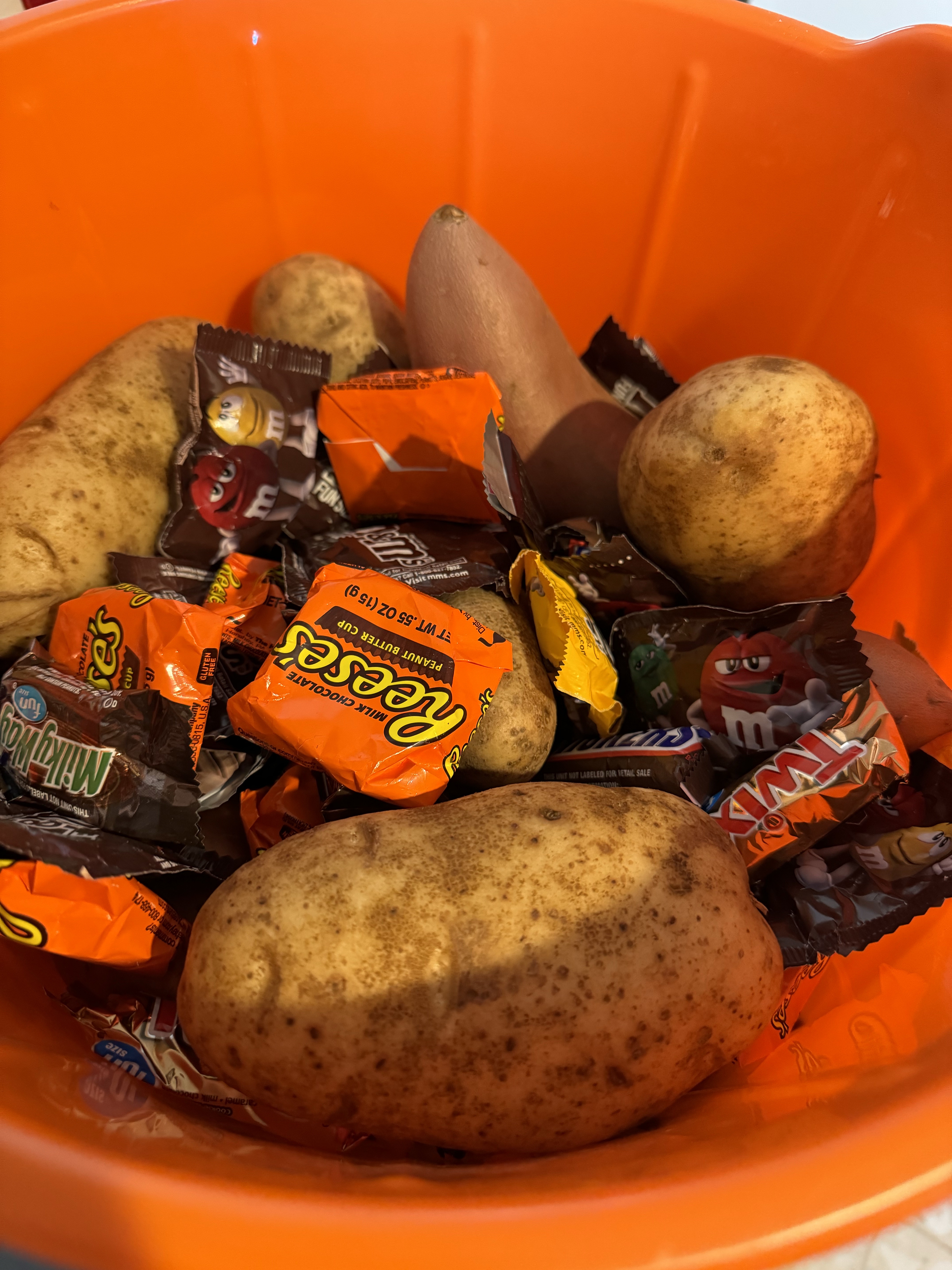 Sneaking potatoes into the candy bucket this Halloween!