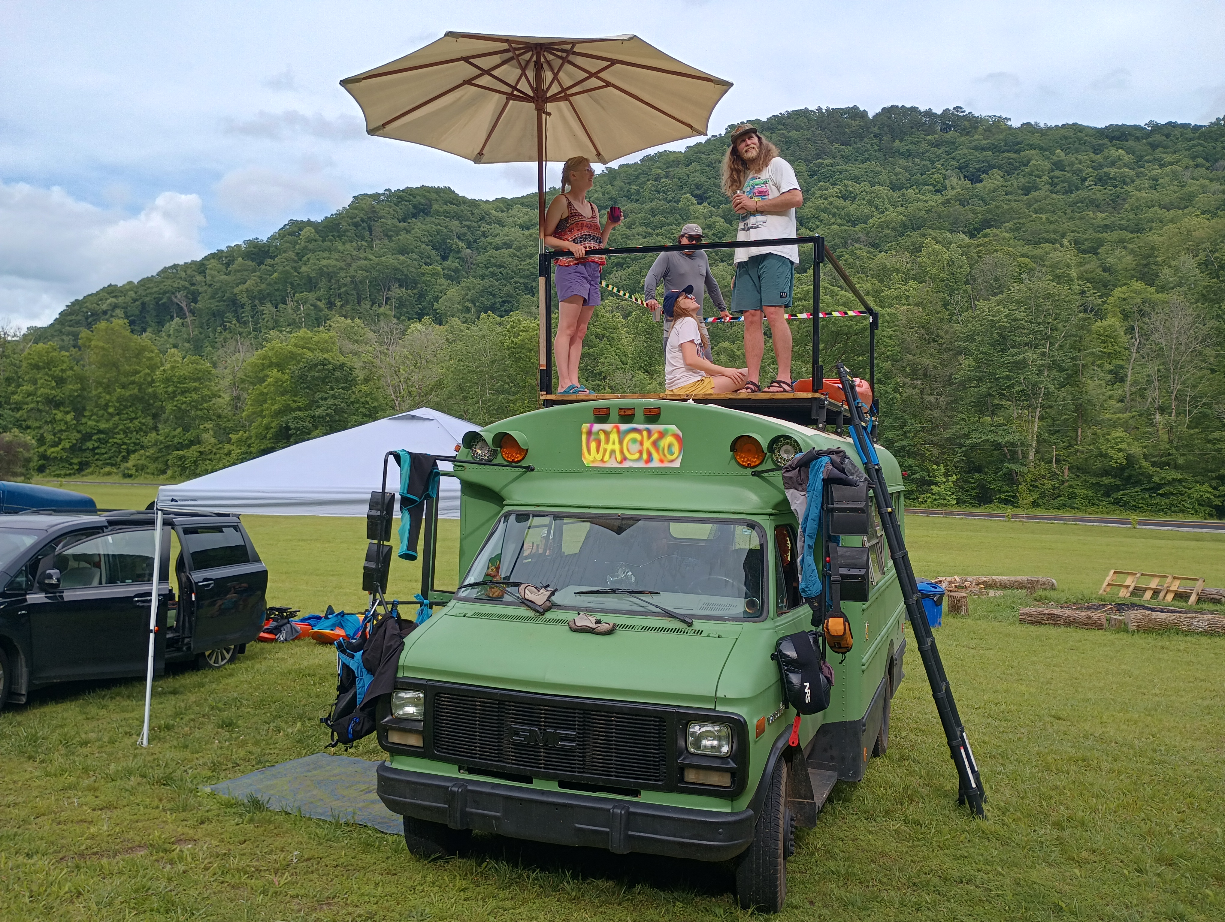 Check out this unique short bus with railings!