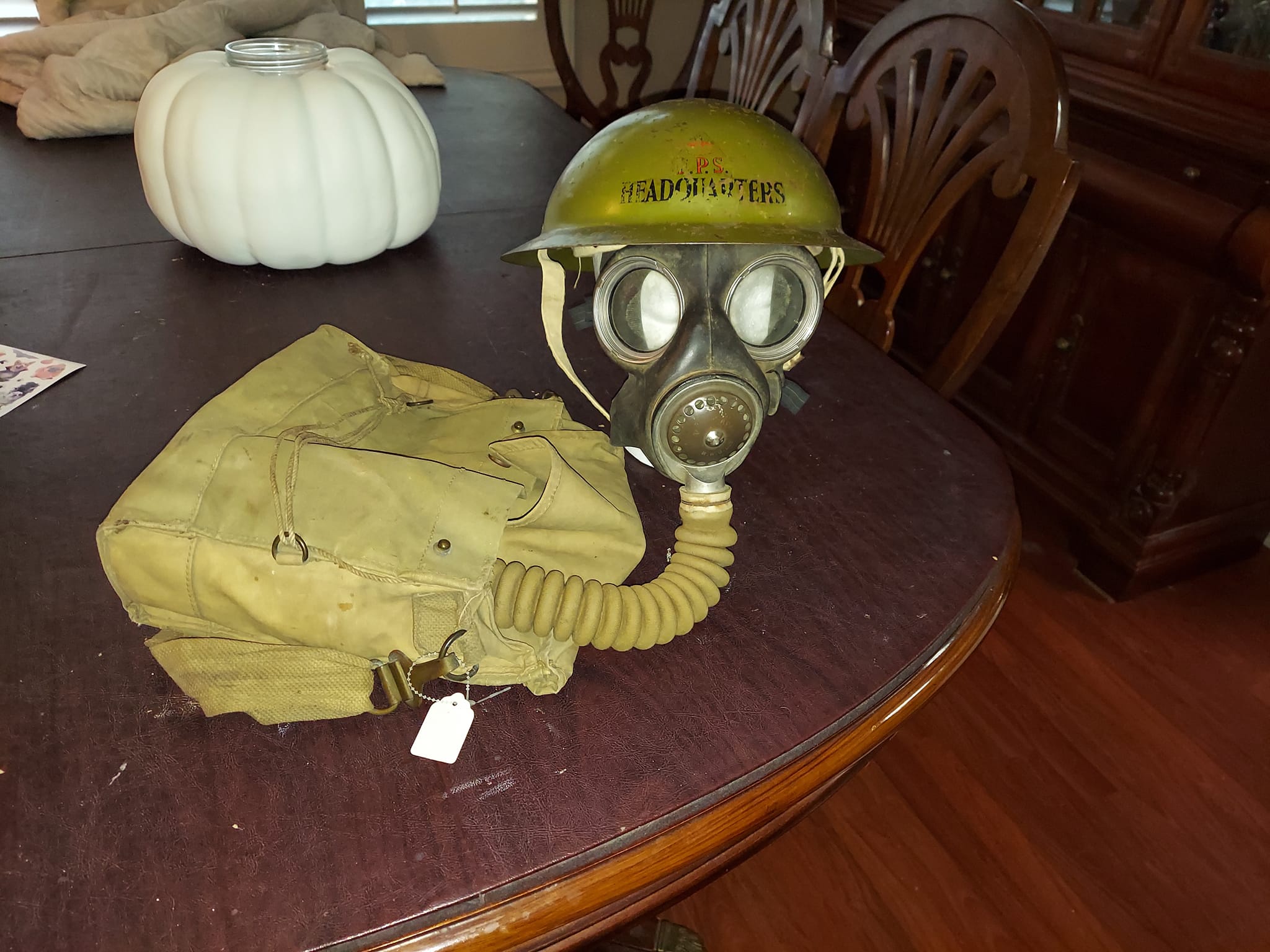 Rare WWII Gas Mask and Helmet on display