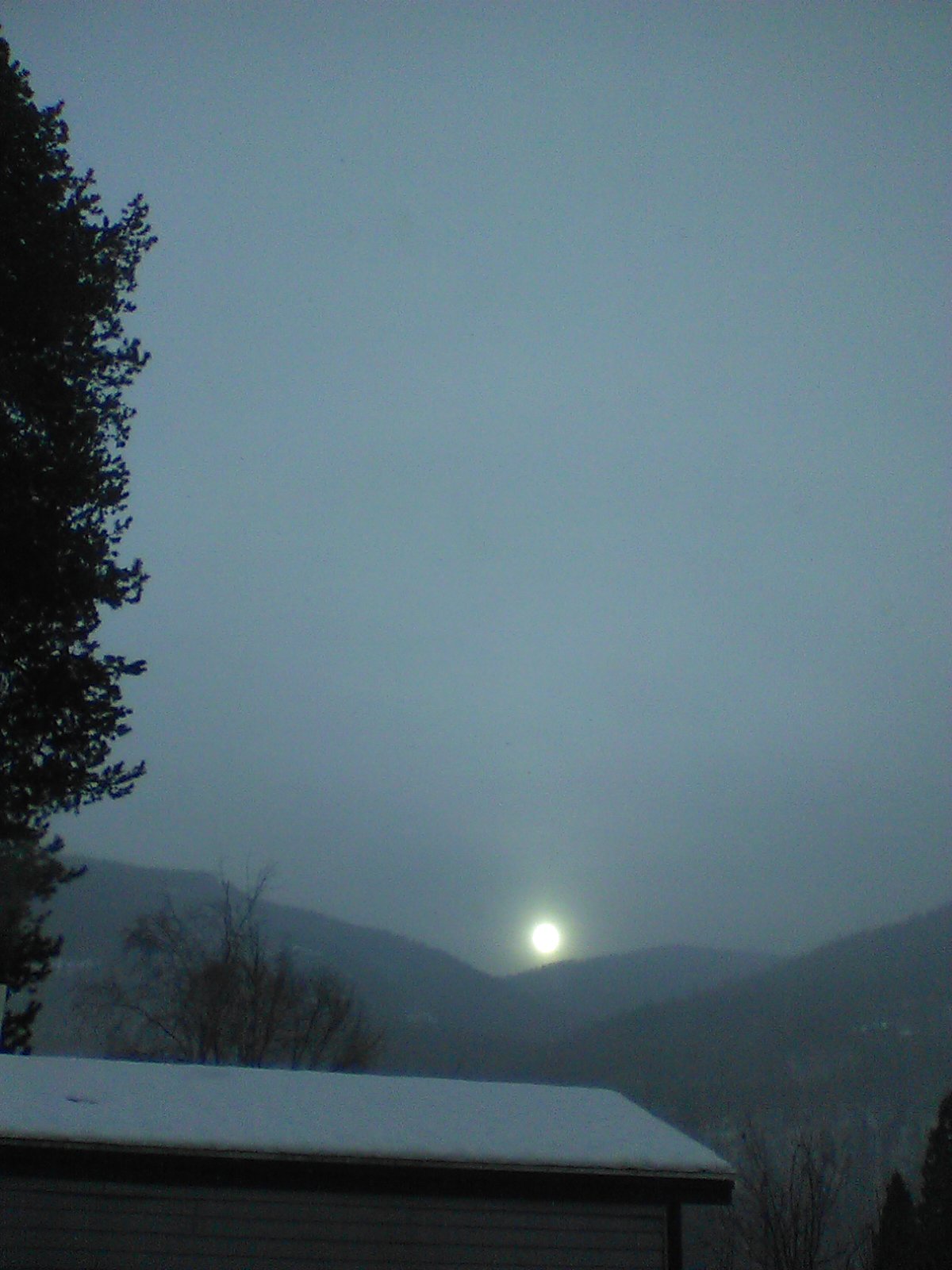 A Stunning Sunrise Behind the Clouds with a Touch of Snow