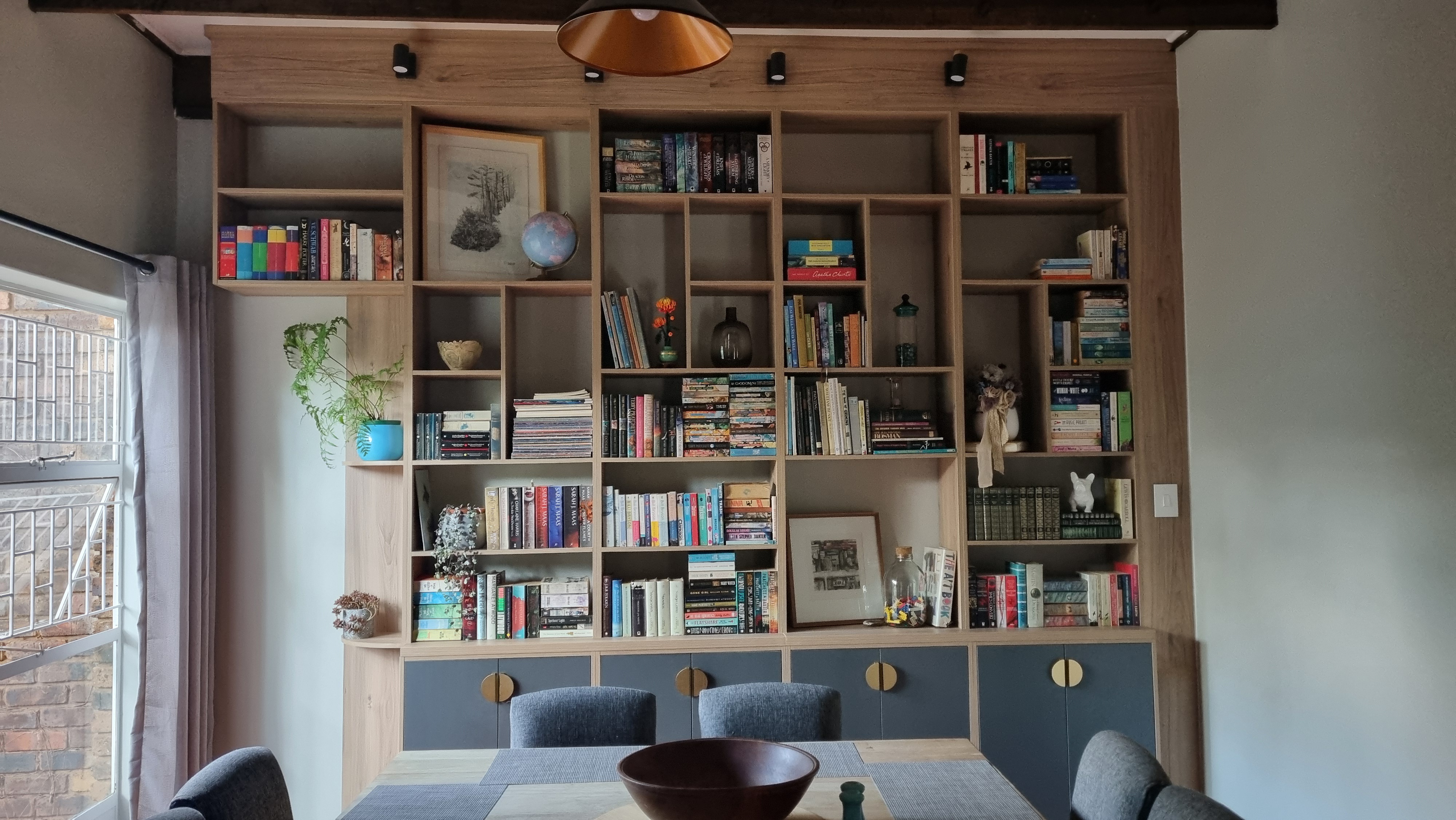Just completed my dream lounge/dining room setup with a stunning library wall!