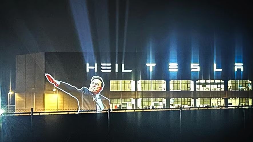 Activists project 'Heil Tesla' onto the Gigafactory Berlin-Brandenburg.