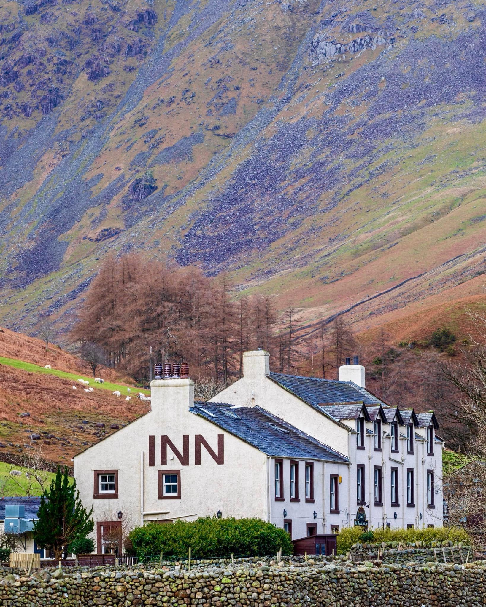 Discover the Wasdale Head Inn, a hidden gem surrounded by the breathtaking mountains of the Lake District.