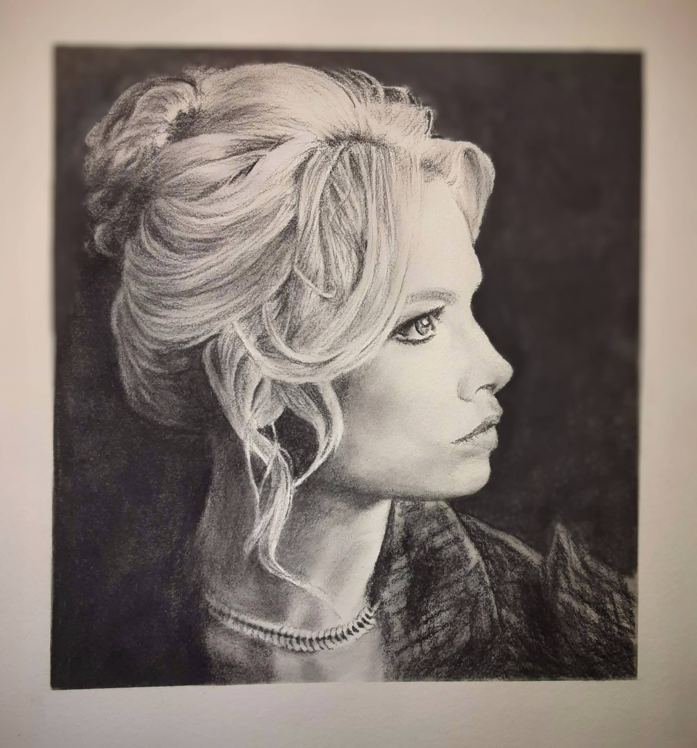 The essence of a strong woman captured in charcoal