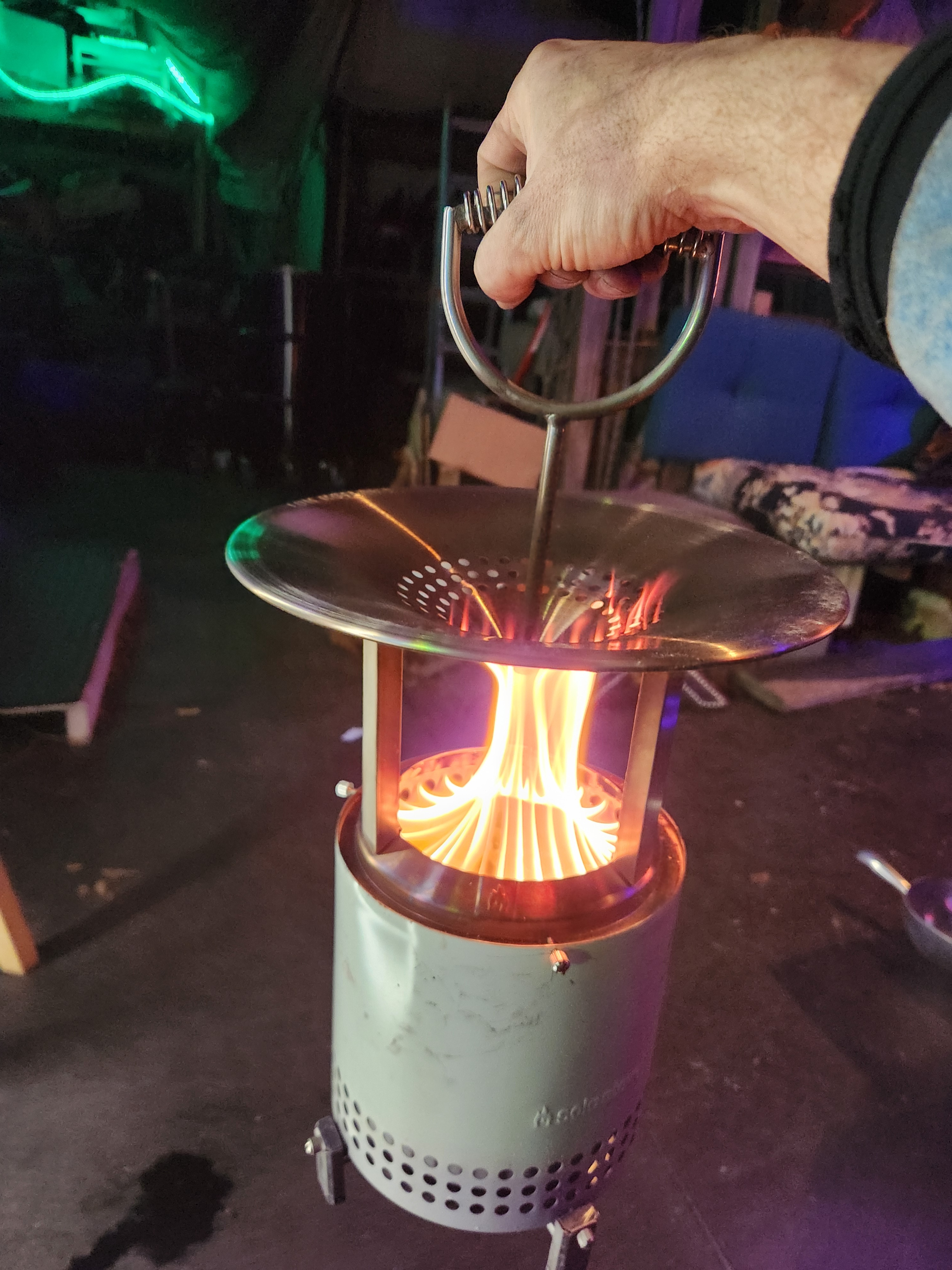 I did the same thing by drilling and tapping directly into the stove to secure the deflector.