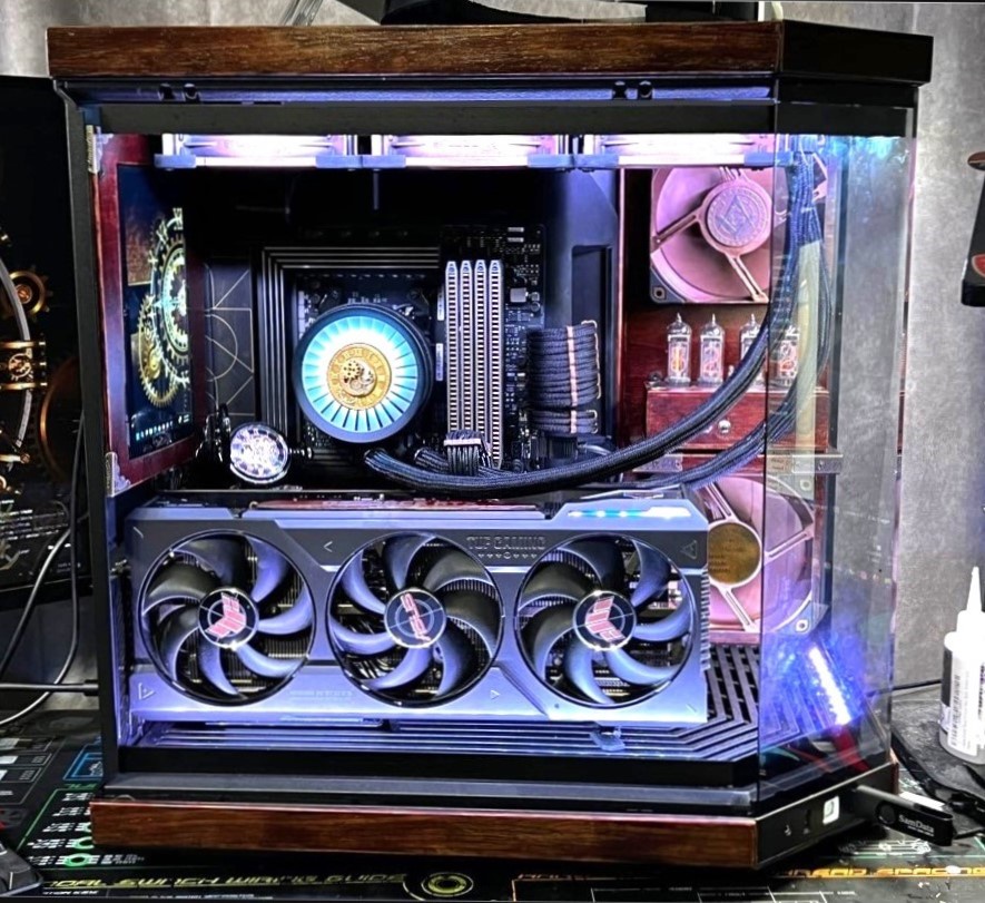 Steampunk-inspired creation featuring a Hyte Y70, walnut panels, and a Nixie clock