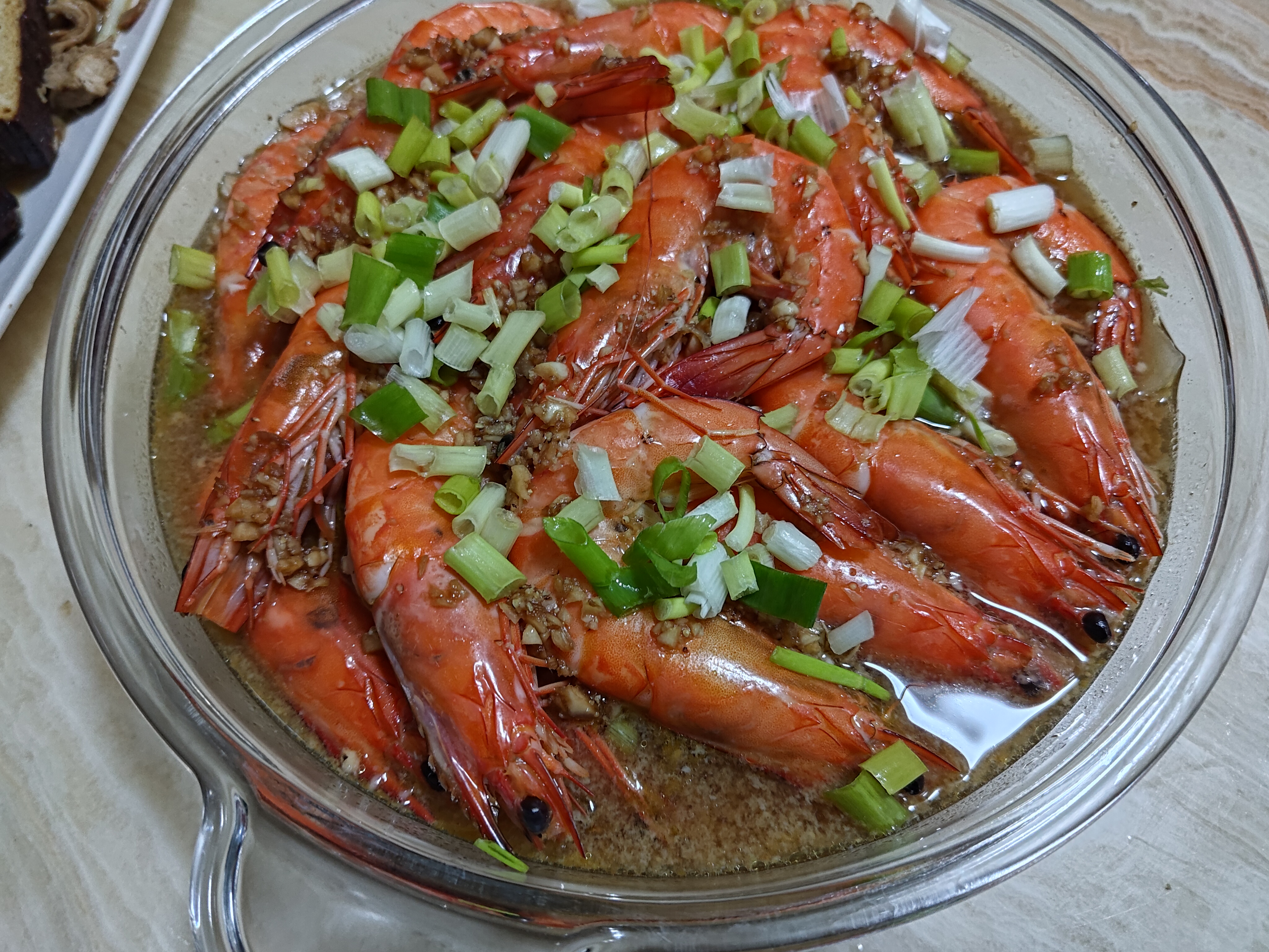 Delicious flat noodles swimming in shrimp and garlic sauce soup