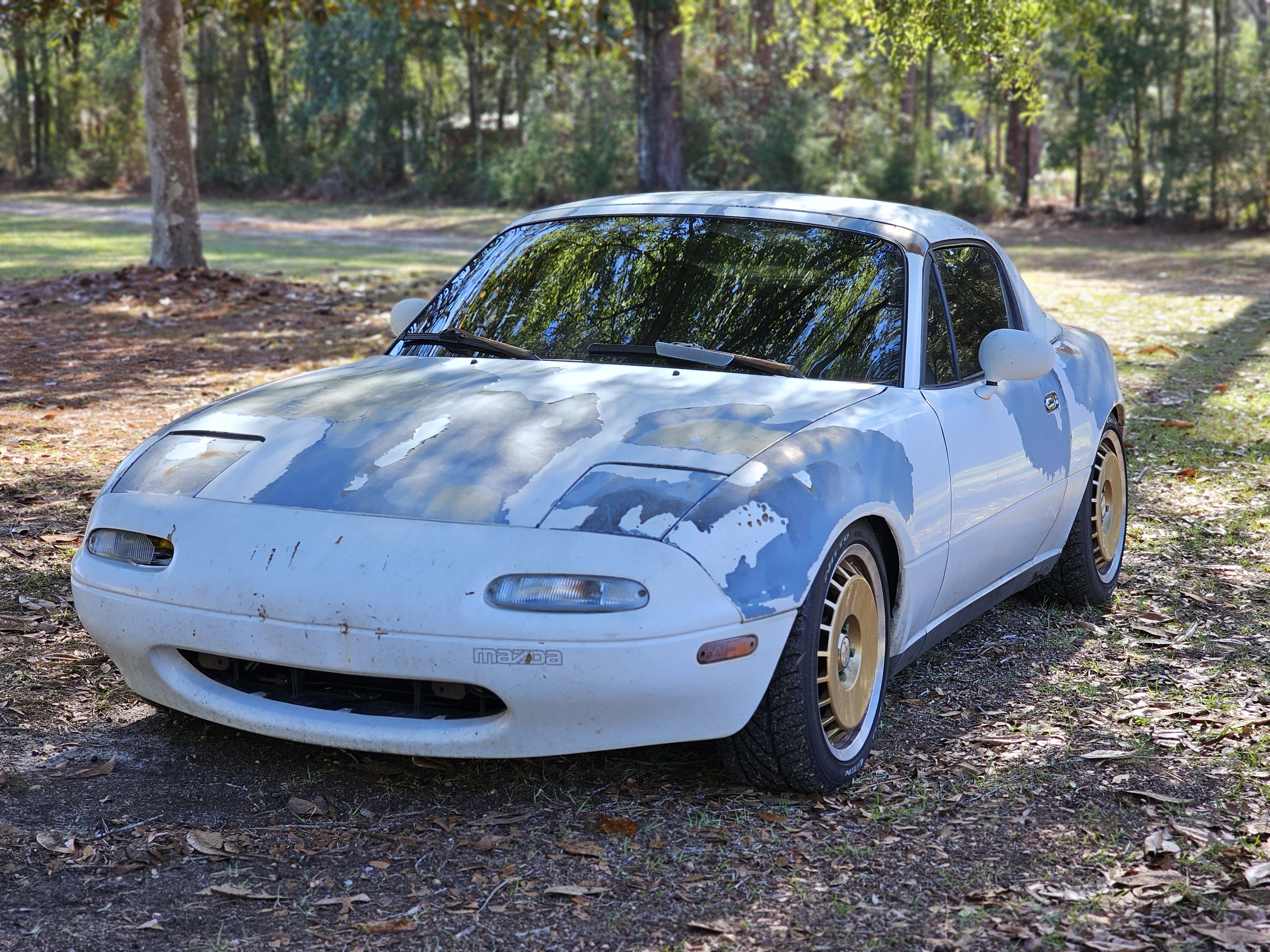As a car parts delivery driver, I encounter some amazing rides like the white Miata, RX7, VW Caddy, and my own Kia Forte SX.