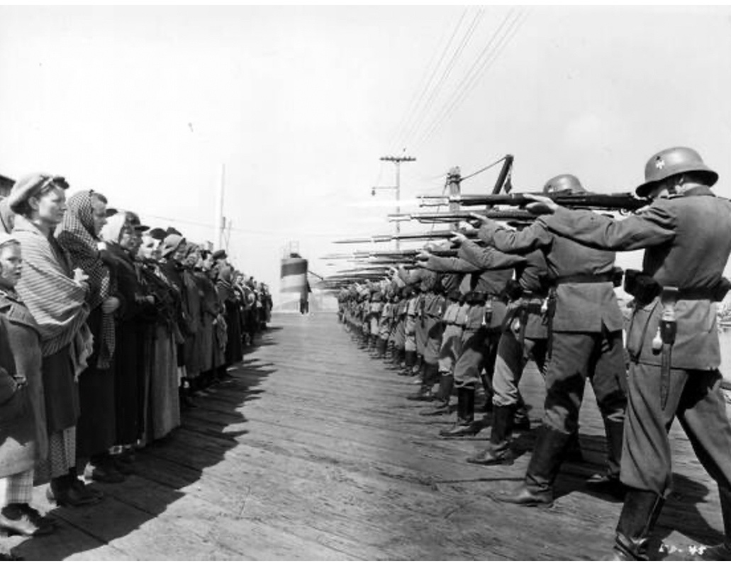 A Tense Standoff: Nazi Firing Squad Confronts Women and Children