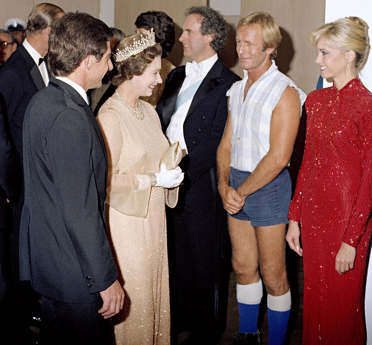 A Historic Meeting: Paul Hogan and Olivia Newton-John with Queen Elizabeth in 1980 Sydney