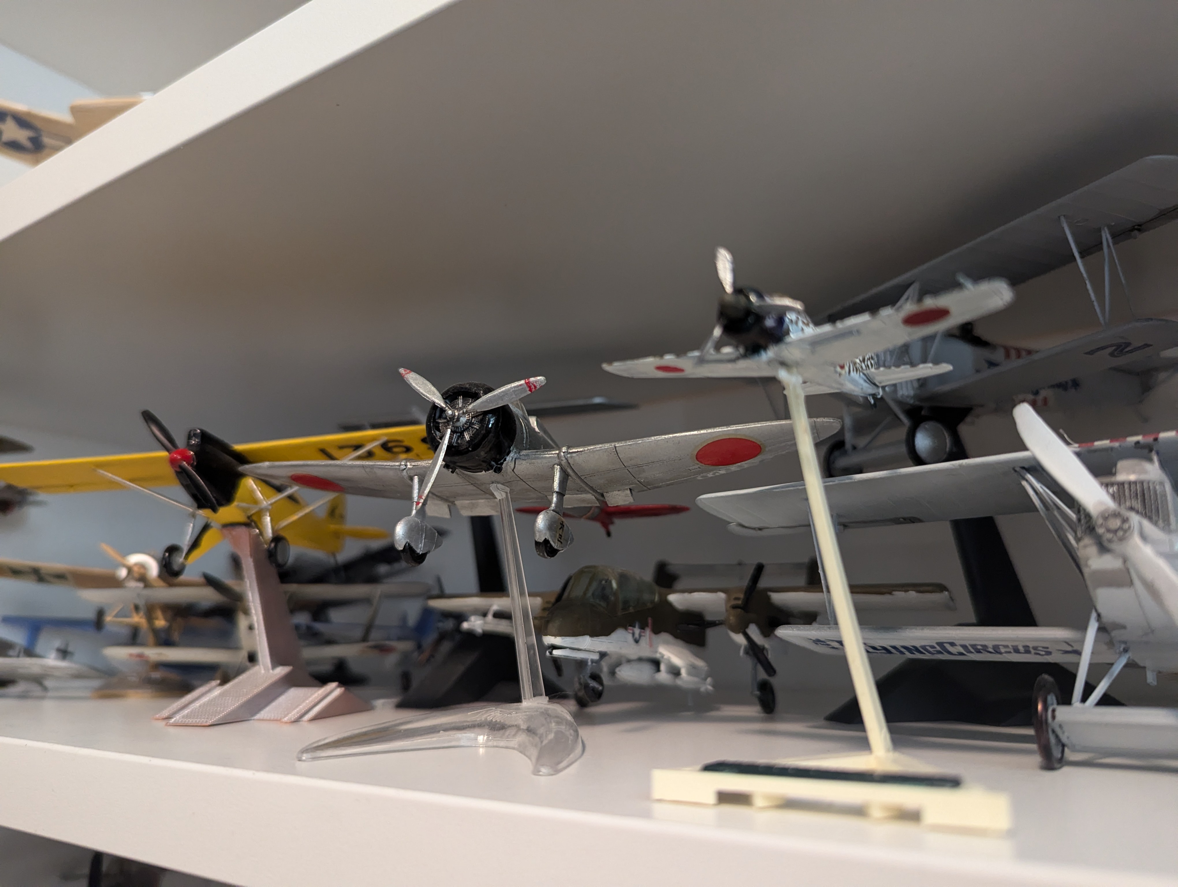 My model shelf is overflowing, so I started building 1/144 scale kits to save space. Check out my first creation: this adorable little Zero!