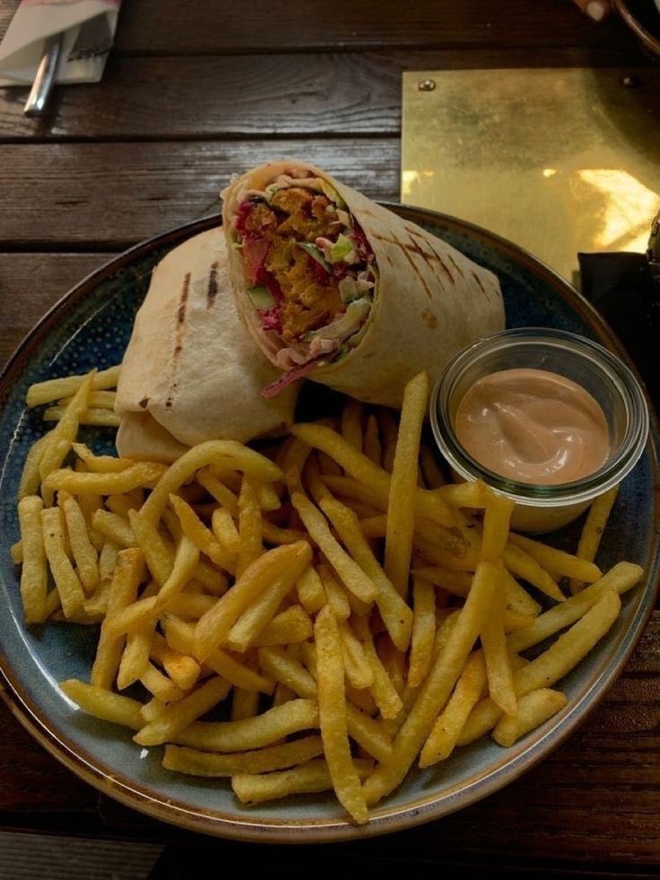 Delicious Chicken Wrap with a Side of Crispy Fries