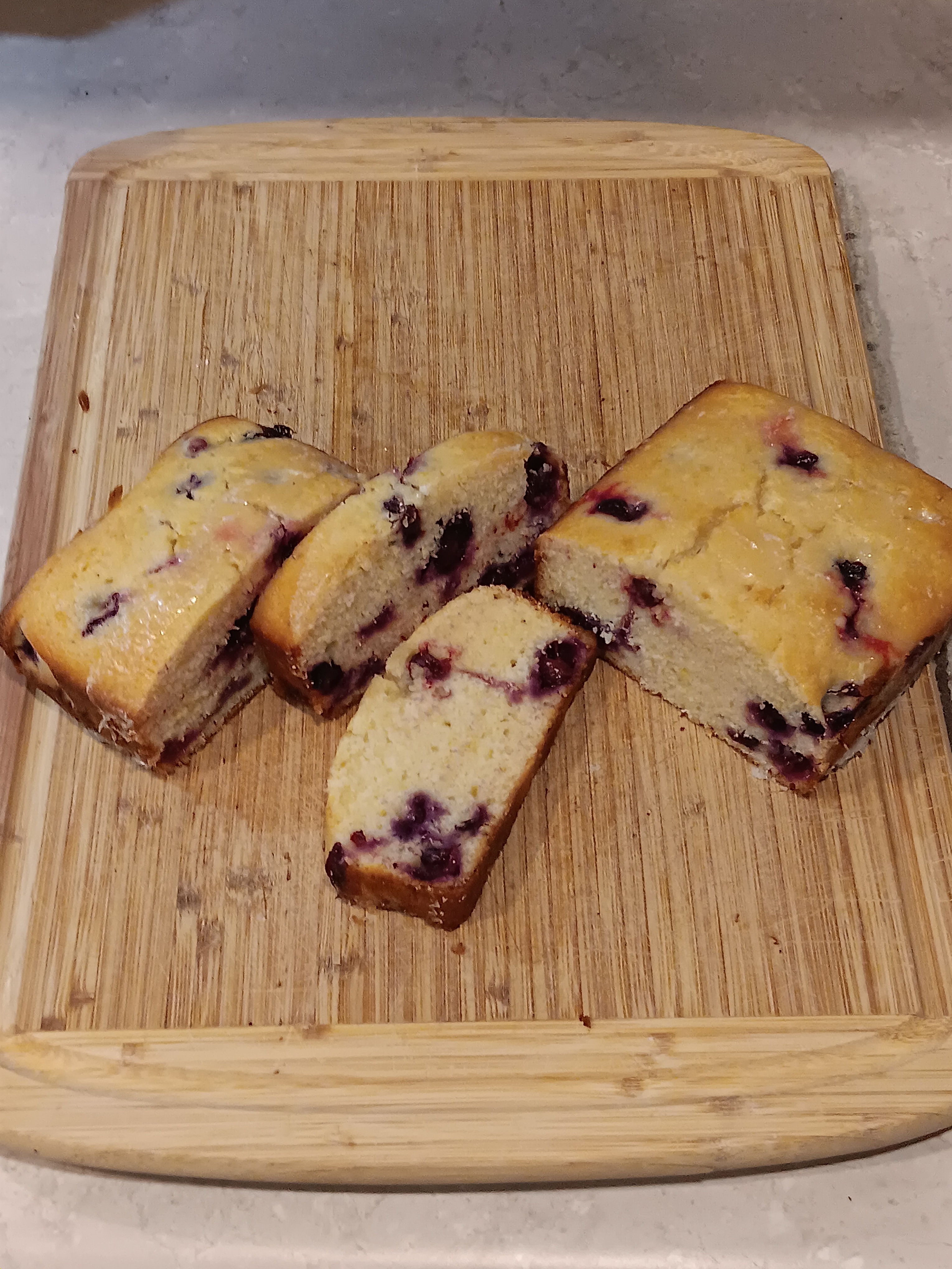 Delicious Lemon-Blueberry Bread Topped with Zesty Lemonhead Glaze!