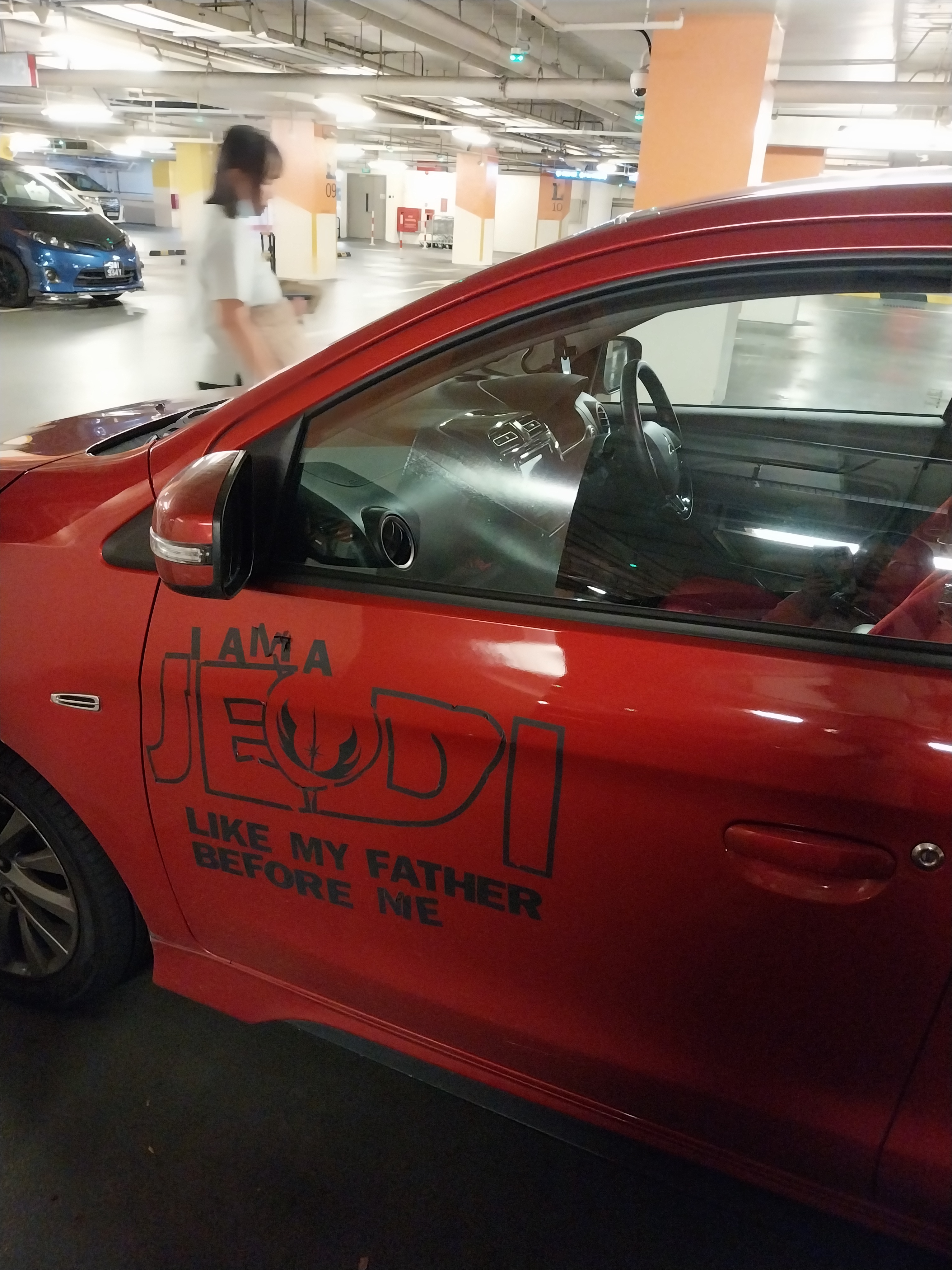 A Jedi-themed car dressed in Sith colors? How cool is that!