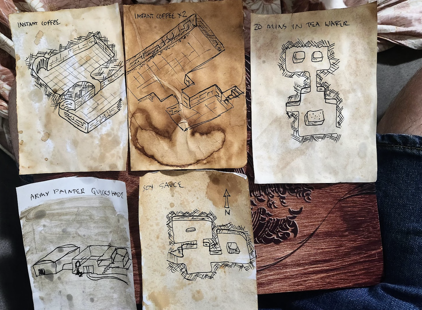 Creative hand-drawn maps on uniquely stained paper