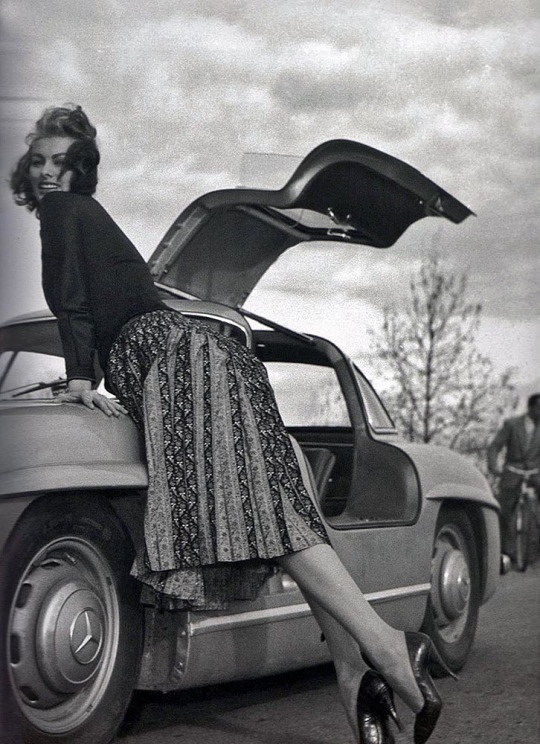 Sophia Loren with her stunning 1955 Mercedes-Benz 300SL Gullwing at the Rally del Cinema in Italy, captured by Federico Patellani in 1956