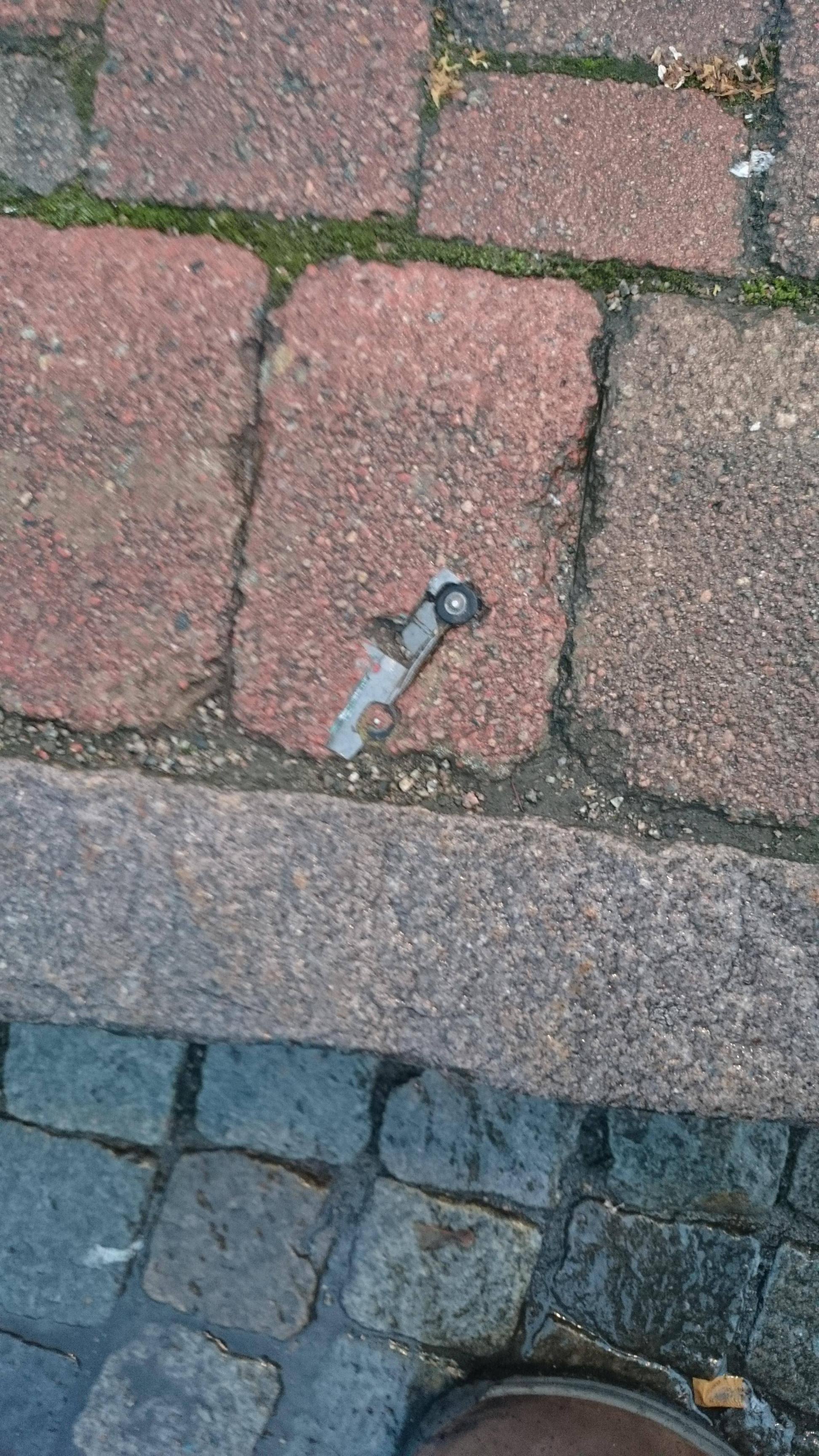 A Surprising Discovery: A Toy Car Embedded in This Brick