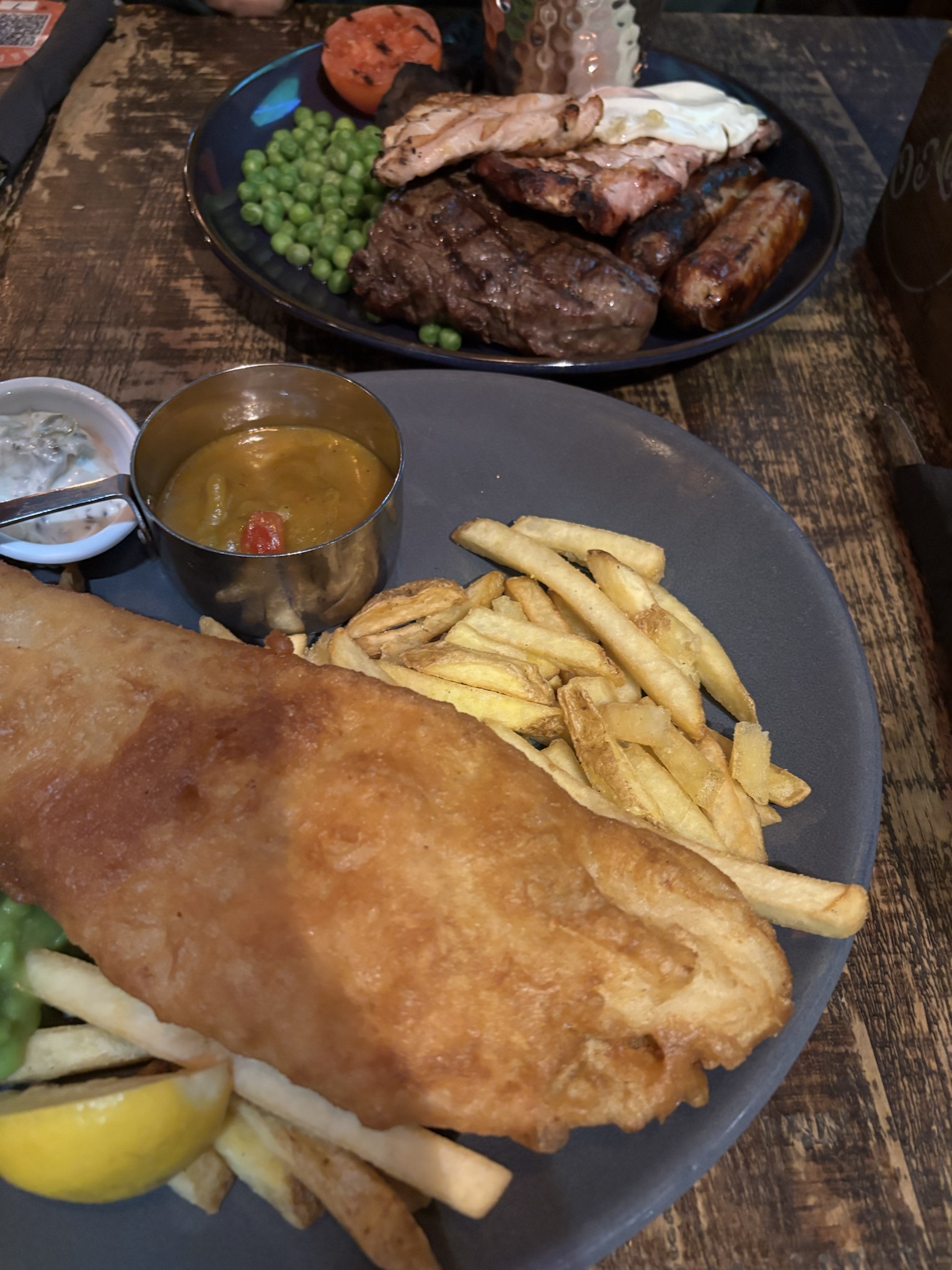 A delicious trio: Fish, chips, and mixed grill!