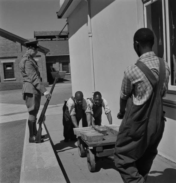 A glimpse into history: Armed guards overseeing gold transport in 1946 Johannesburg.