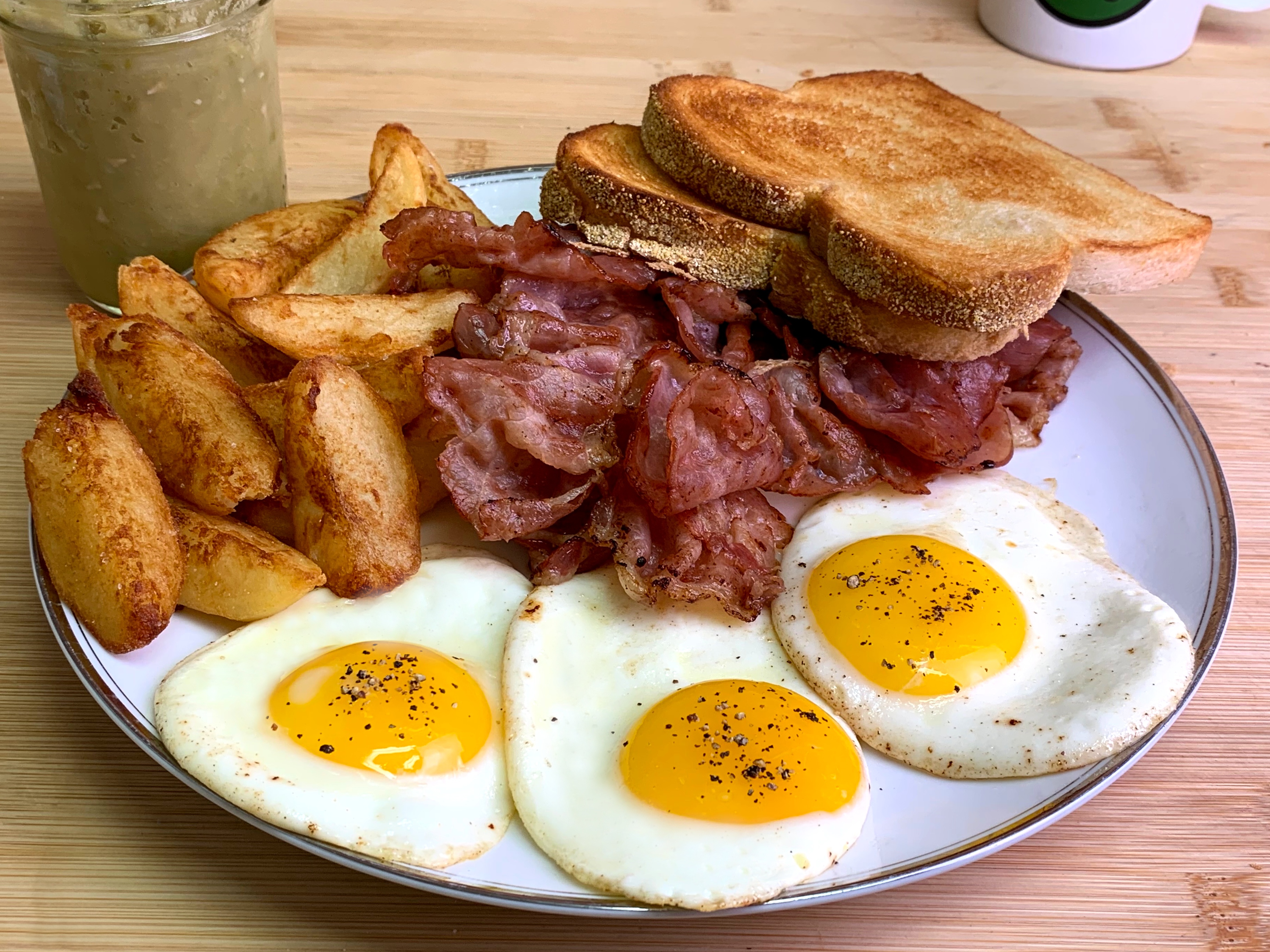 Delicious Egg and Chips Served with Savory Homemade Back Bacon