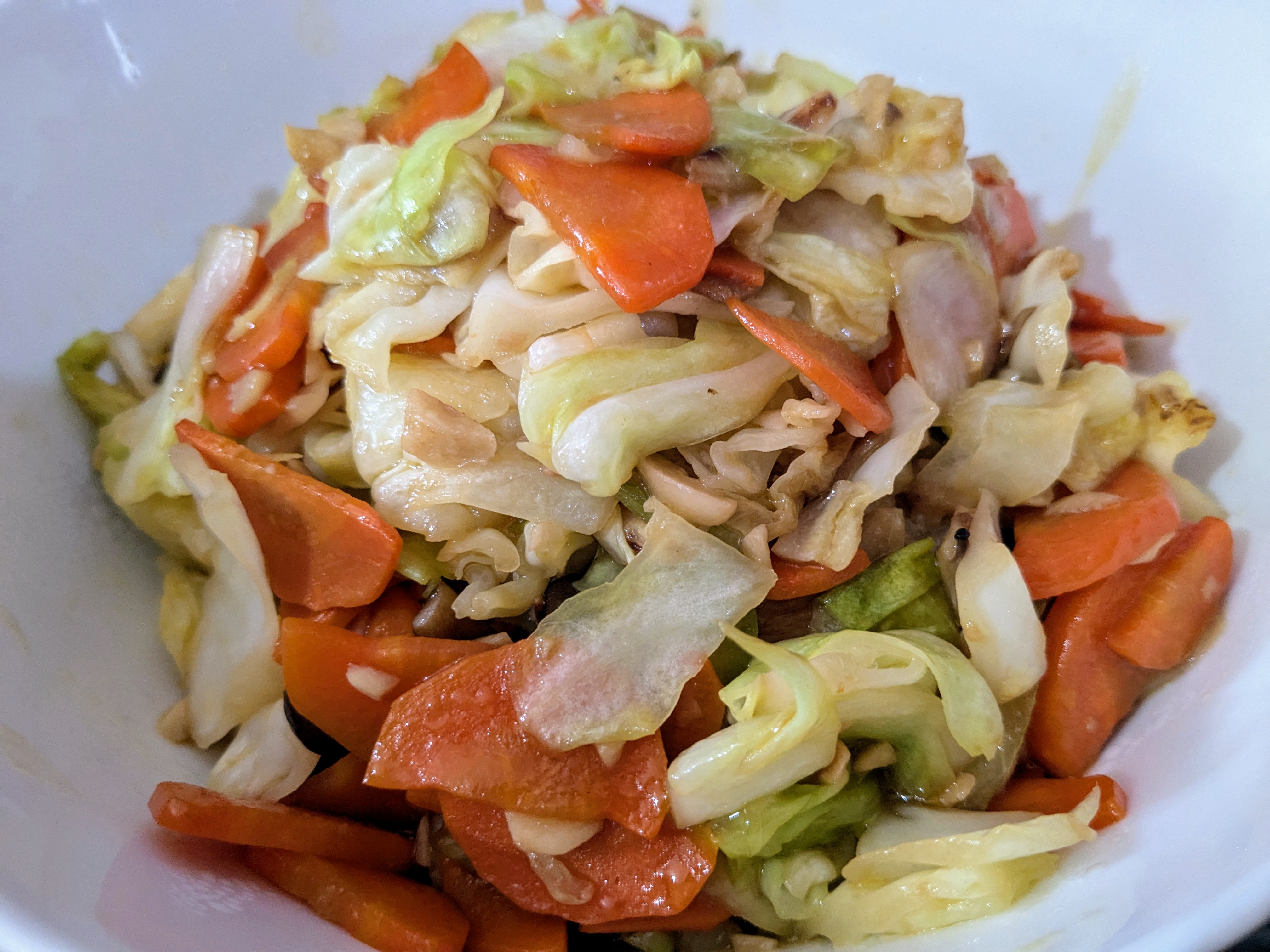 Delicious Stir Fry: Cabbage, Carrots, Fresh Mushrooms, and Chinese Red Wine Sausages with Onions