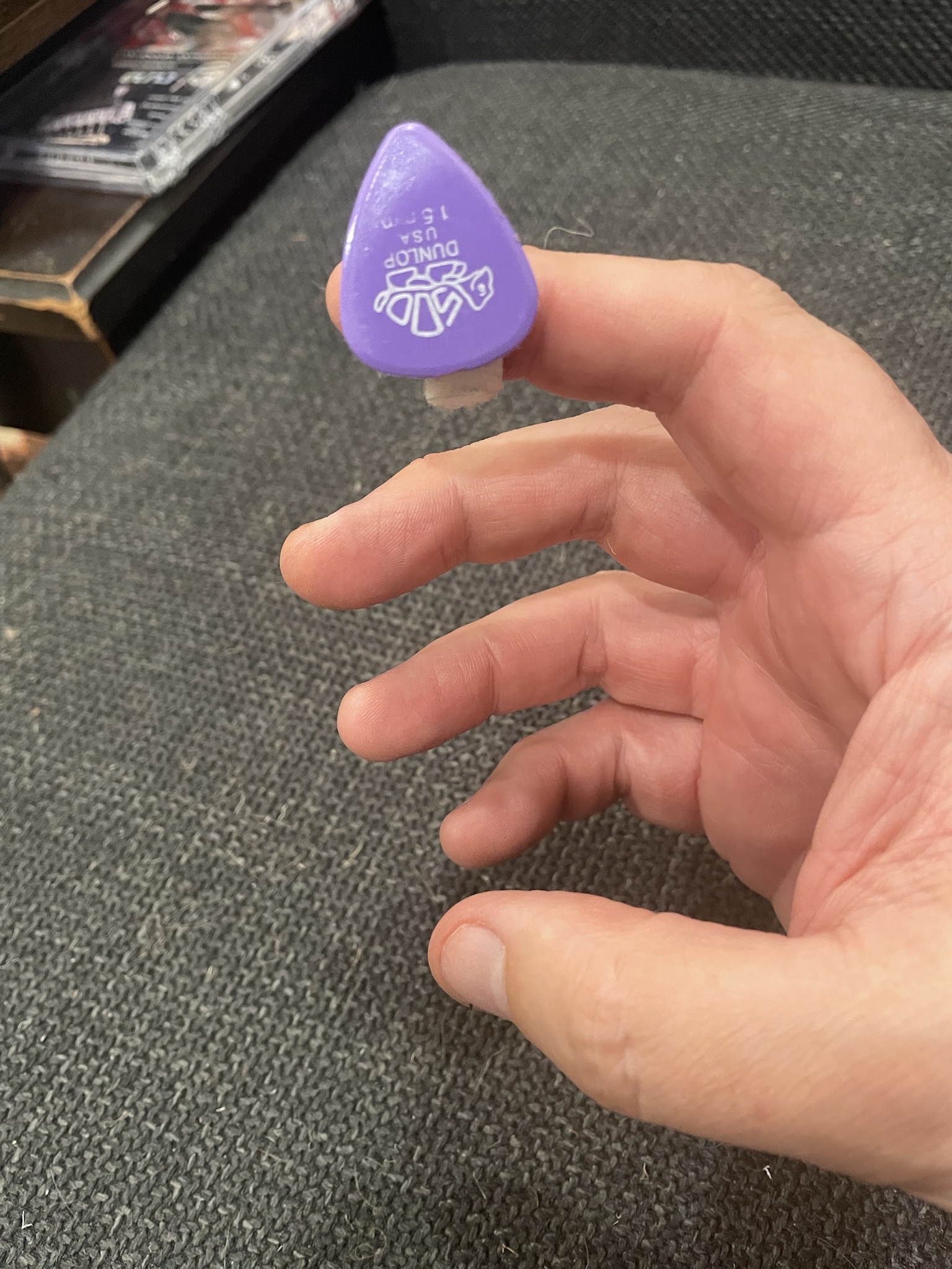 Modifying a guitar pick with Velcro due to nerve damage in my right index finger.