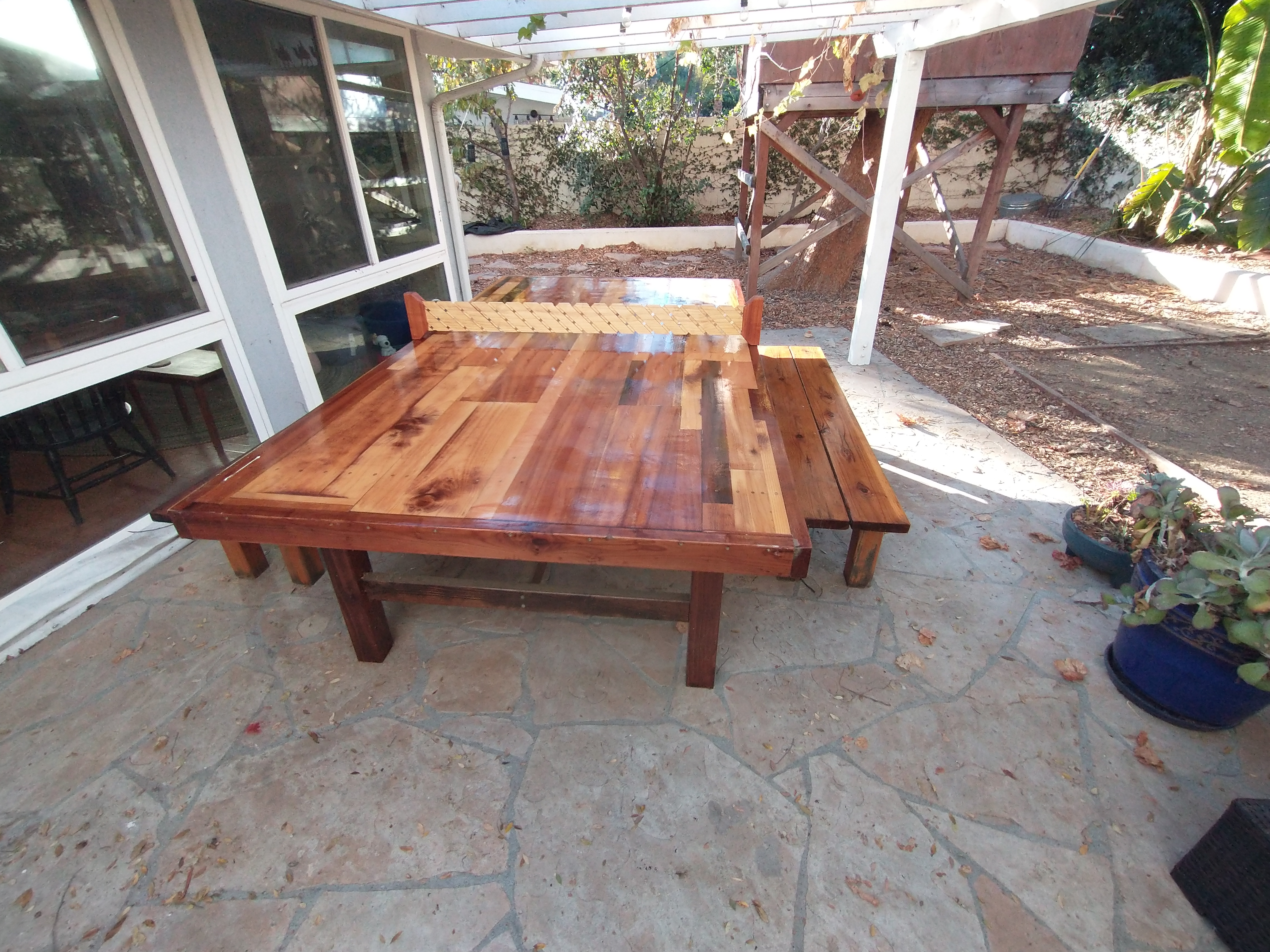 Charming Backyard Setup with Ping Pong and Rustic Benches