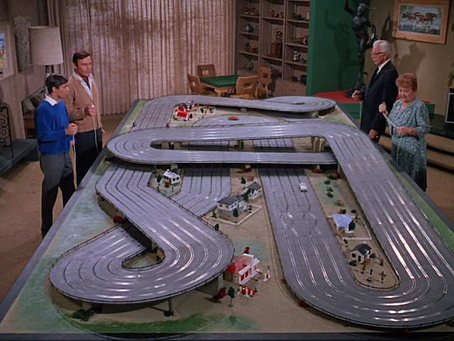 Bruce Wayne takes a break for some intense slot-car racing!