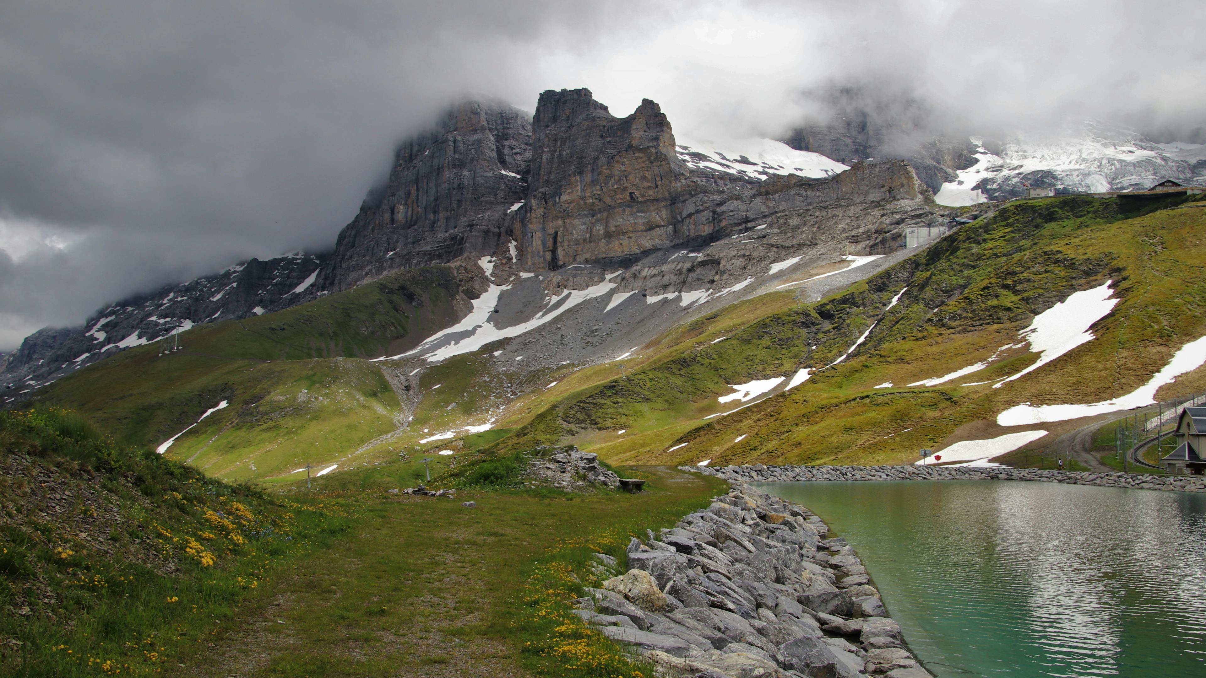 Explore the Majestic Rocky Peaks and Lush Emerald Valley