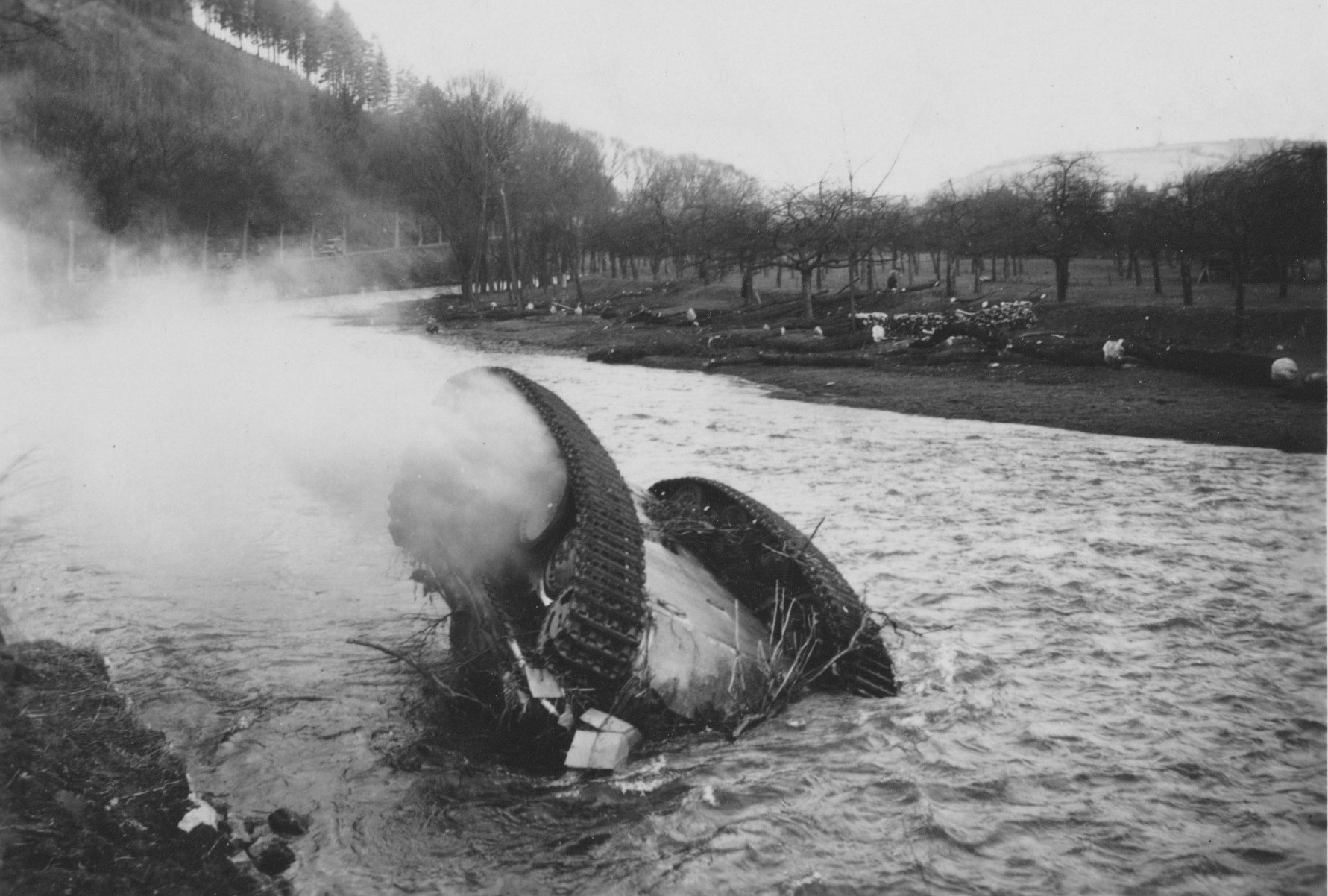 A Panther Ausf. G from Panzer-Abteilung 2105 toppled in the Verdre River, captured by Captain John William Goodwin of the 814th Tank Destroyer Battalion.