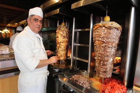 A woman walks into a shawarma place and just wants the meat!