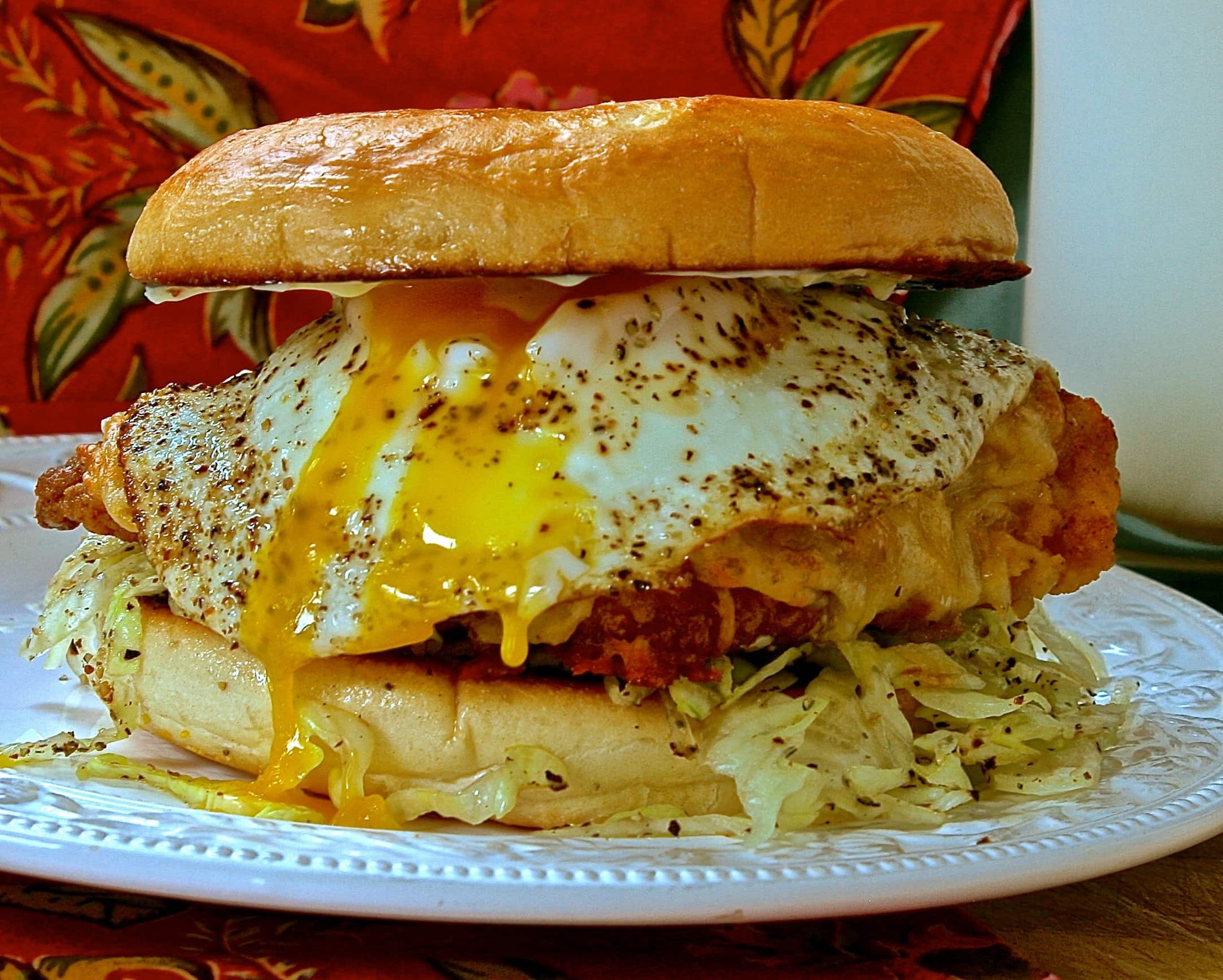 Savoring a Fried Chicken and Egg Sandwich Delight
