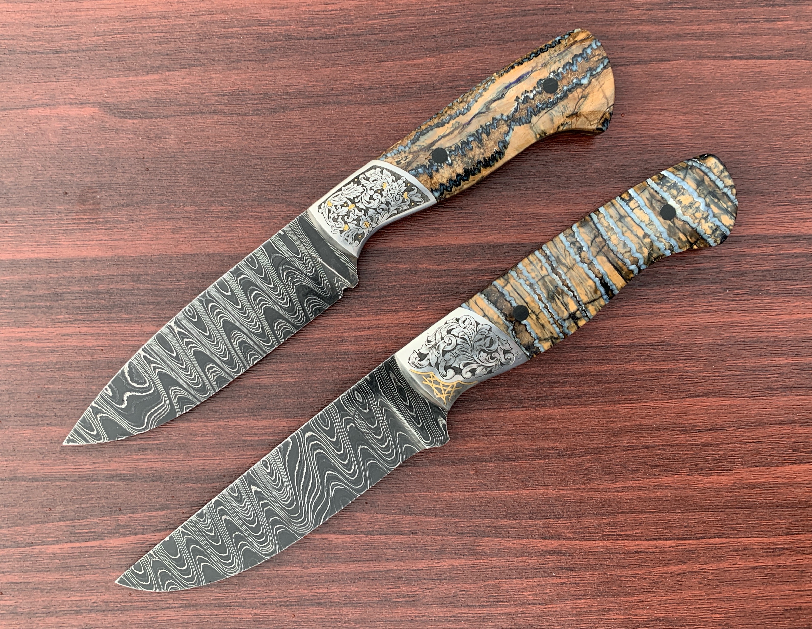 Celebrating my 400th and 401st knives, beautifully engraved by Alice Carter.