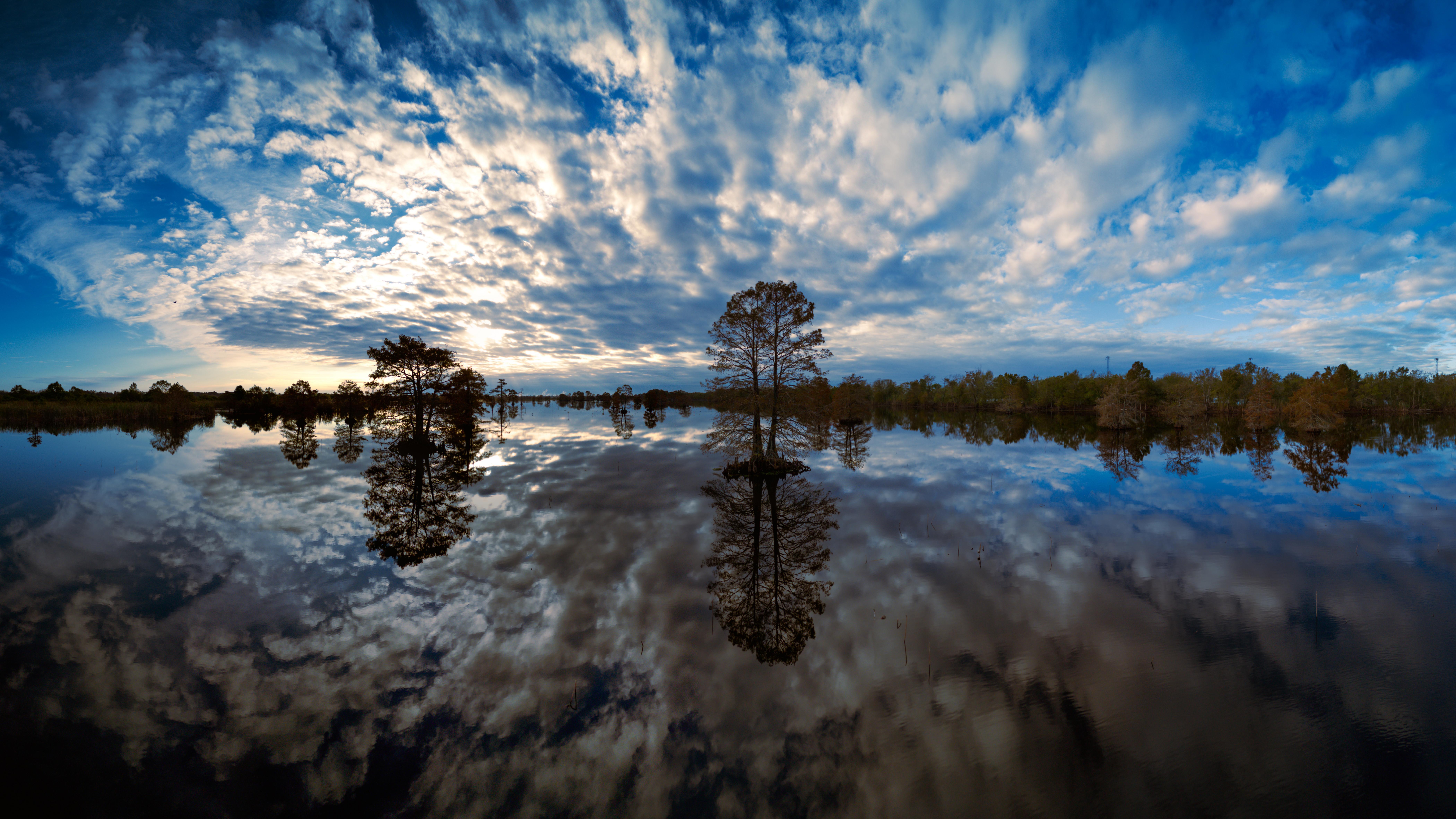 A Moody Cloudy Day Reflected Over Serene Waters