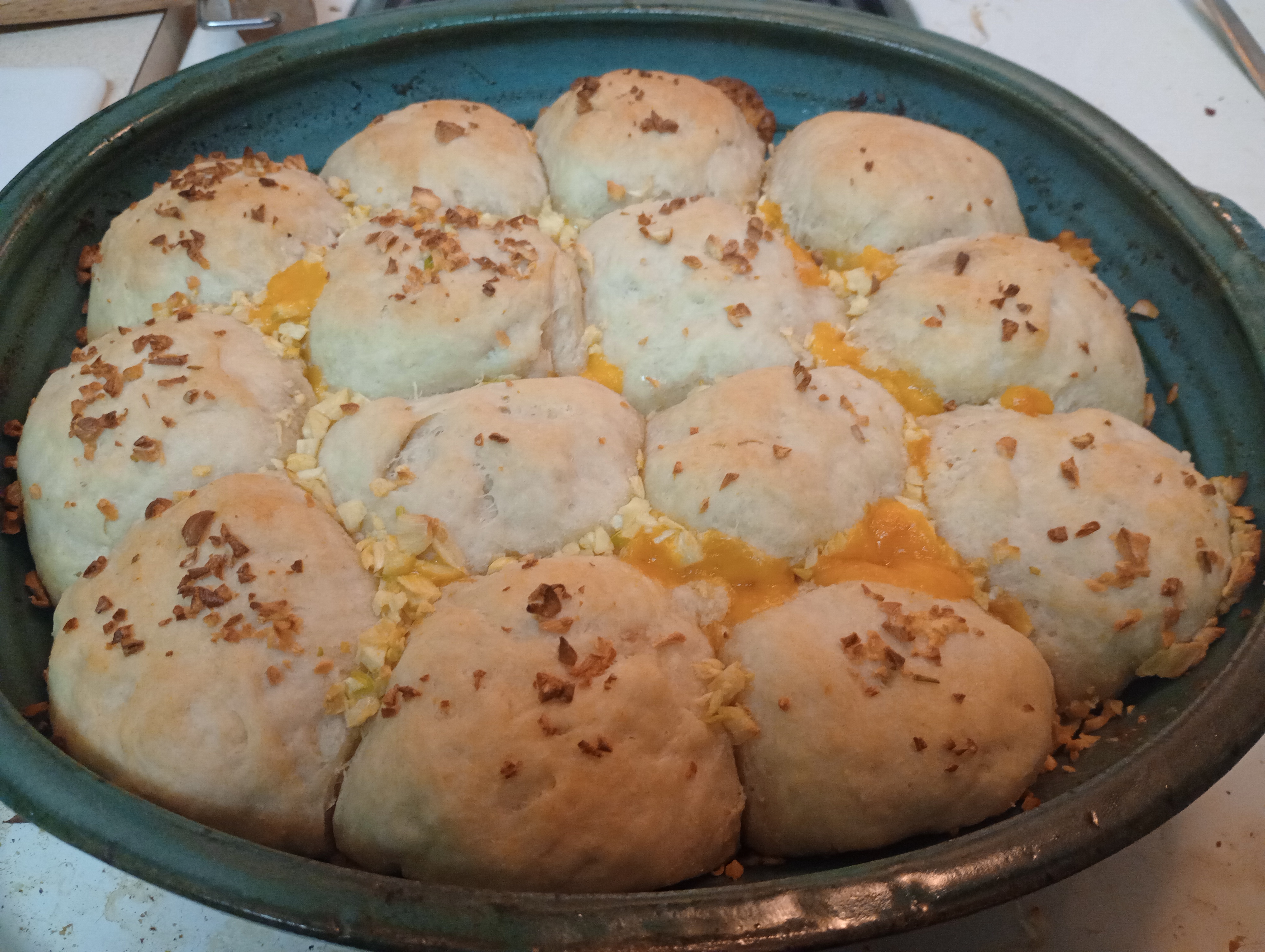 Baking Magic: Christening My New Dish with Cheesy Garlic Rolls