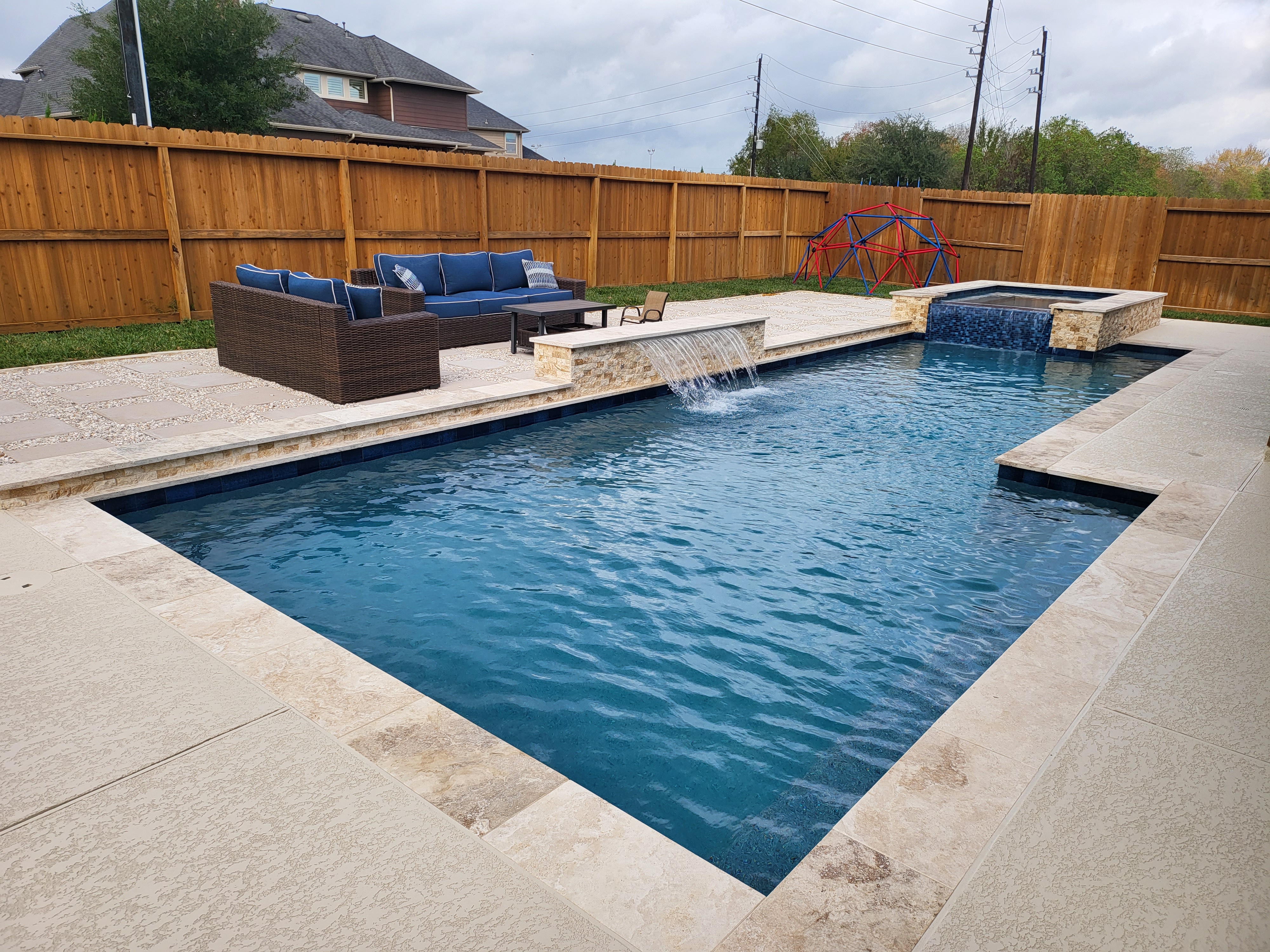 A Pool with Tiramisu Coping and a Split Personality