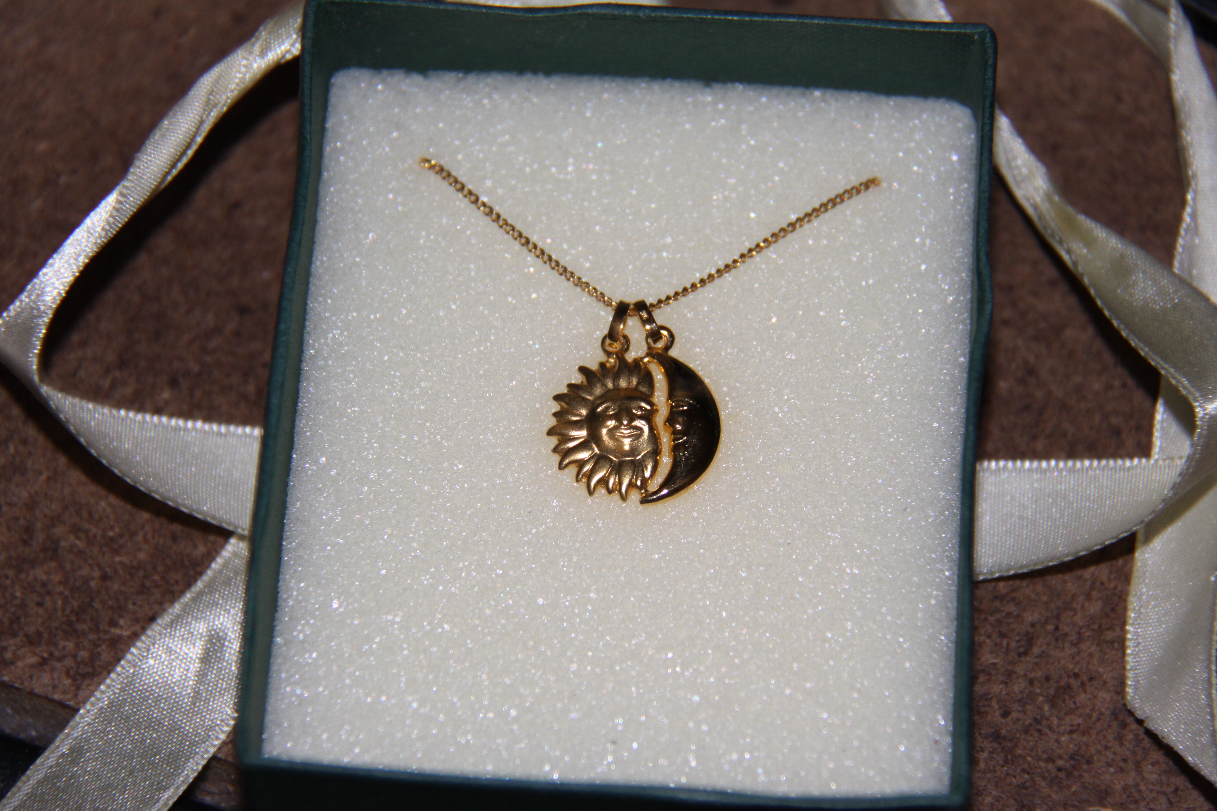 A beautiful sun and moon necklace design.