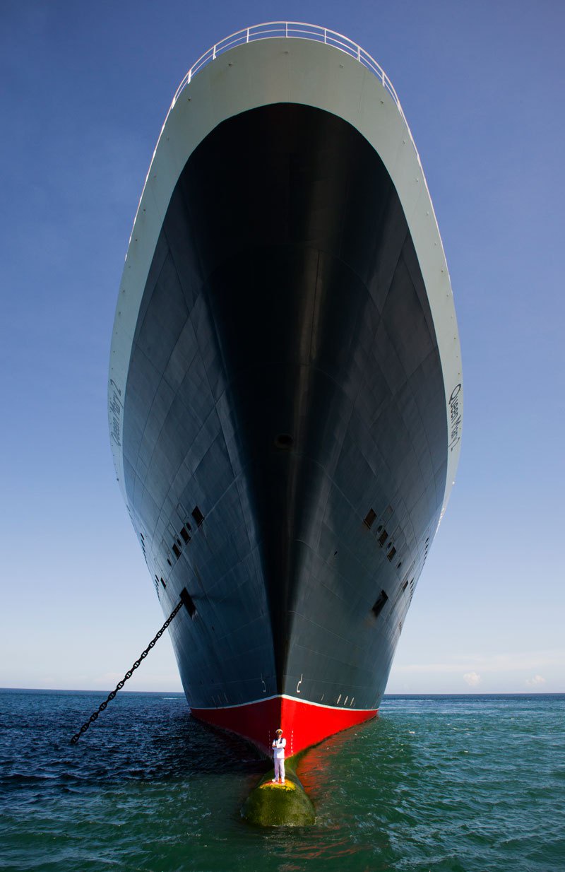 Captain Posing Proudly on the Bow of the Queen Mary 2