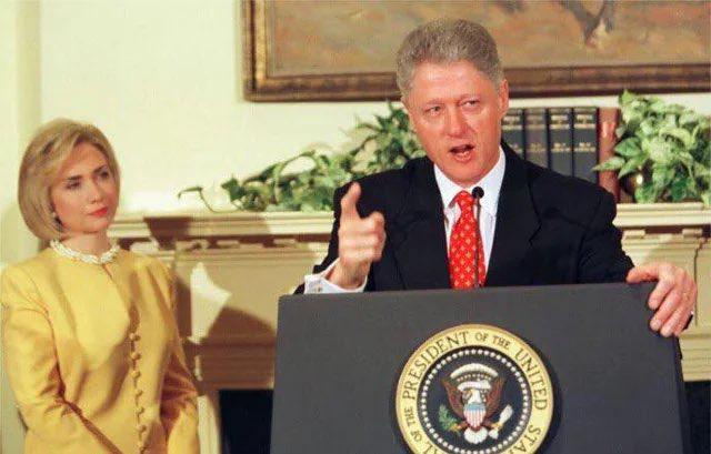 Hillary Clinton's focused attention as Bill Clinton denies his affair with Monica Lewinsky back in 1998.