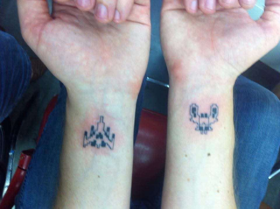 Check out these awesome Galaga tattoos!