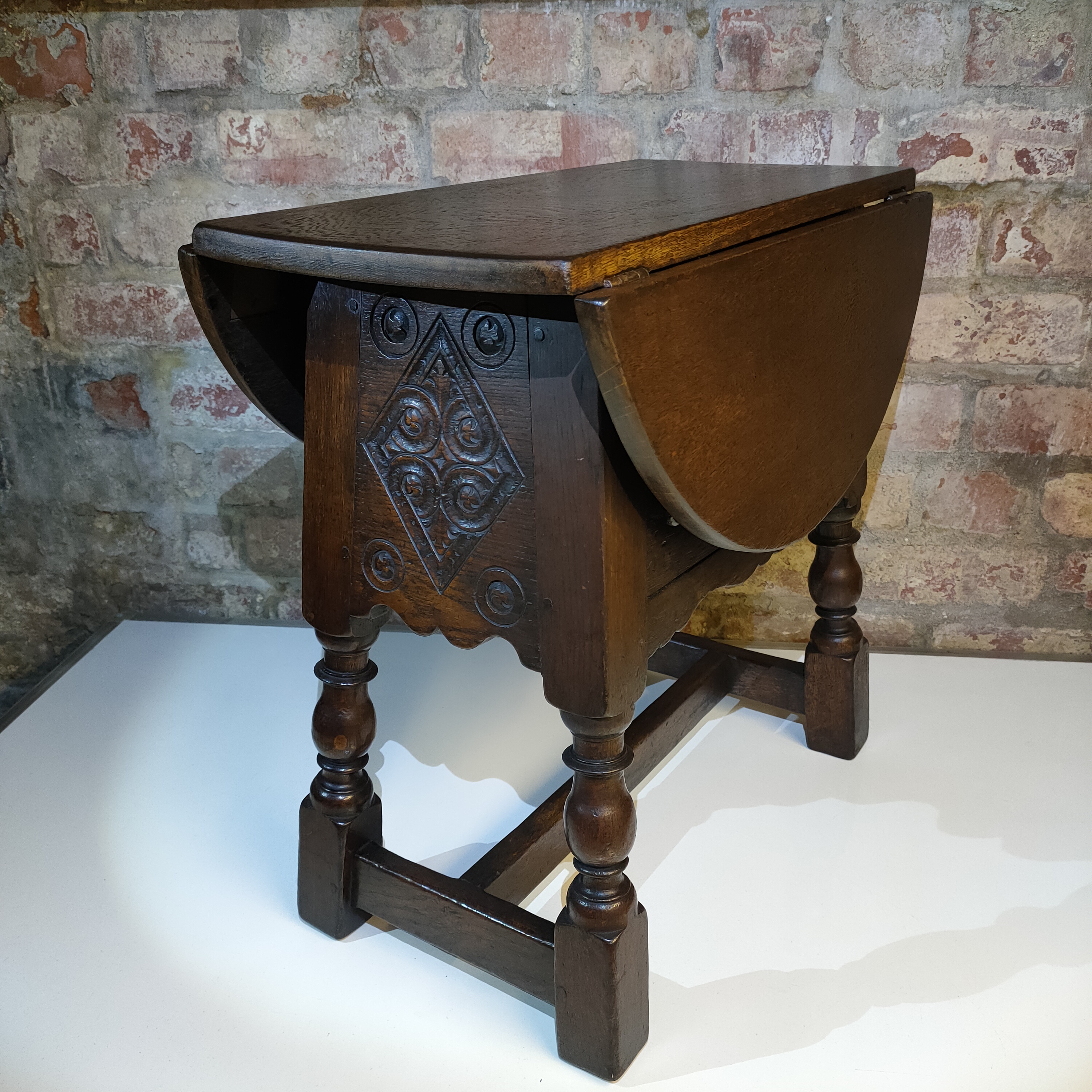 Discover the Charm of an Antique Swivel Top Drop Leaf Table