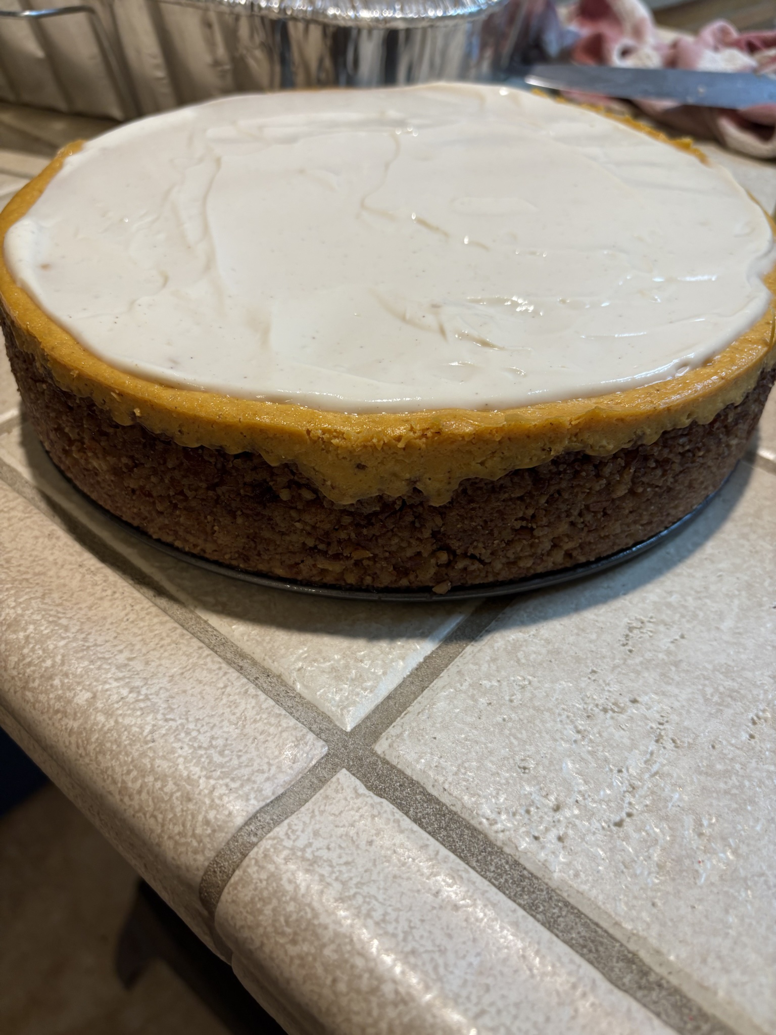 Indulge in This Heavenly Pumpkin Cheesecake with Pecan Crust and Maple-Brown Sugar Topping