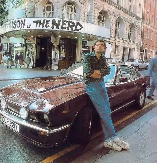 Rowan Atkinson Poses with His 1977 Aston Martin V8 Vantage