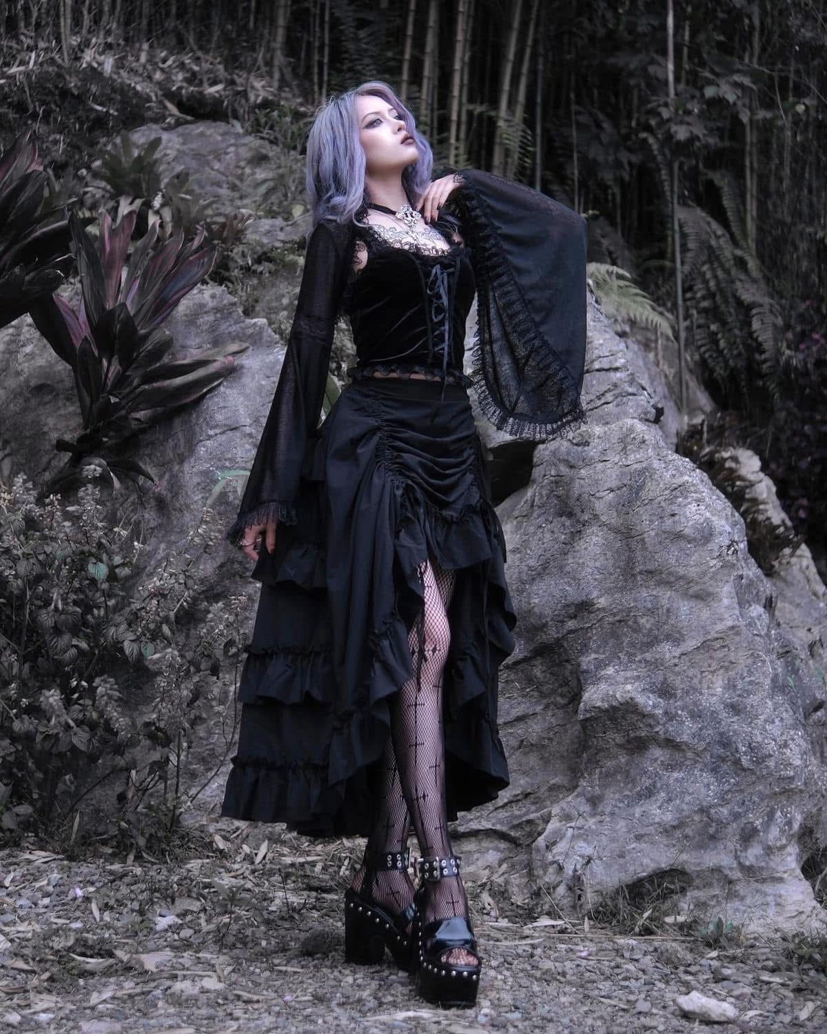 Admiring her stunning dress and stylish tights