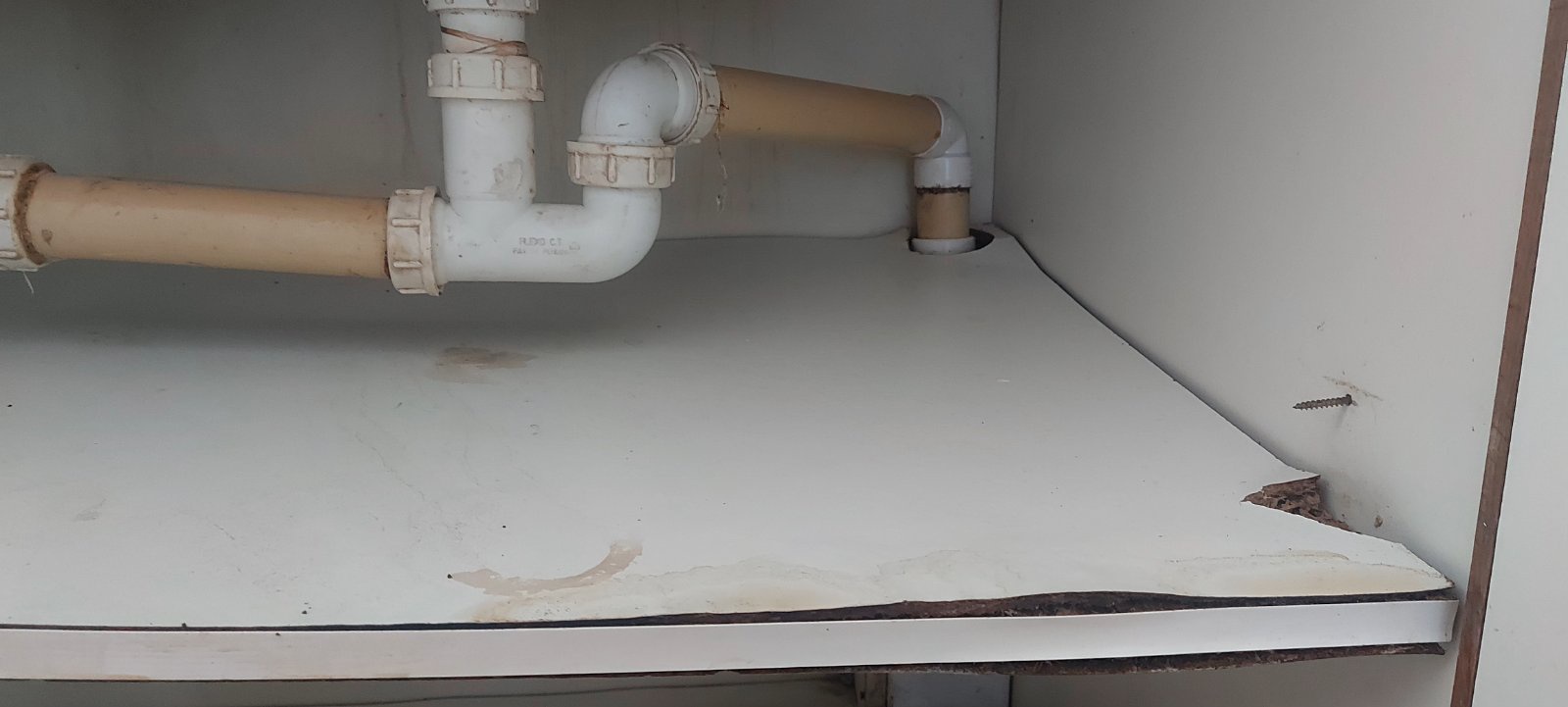 Why does water always splash onto your feet while doing dishes?