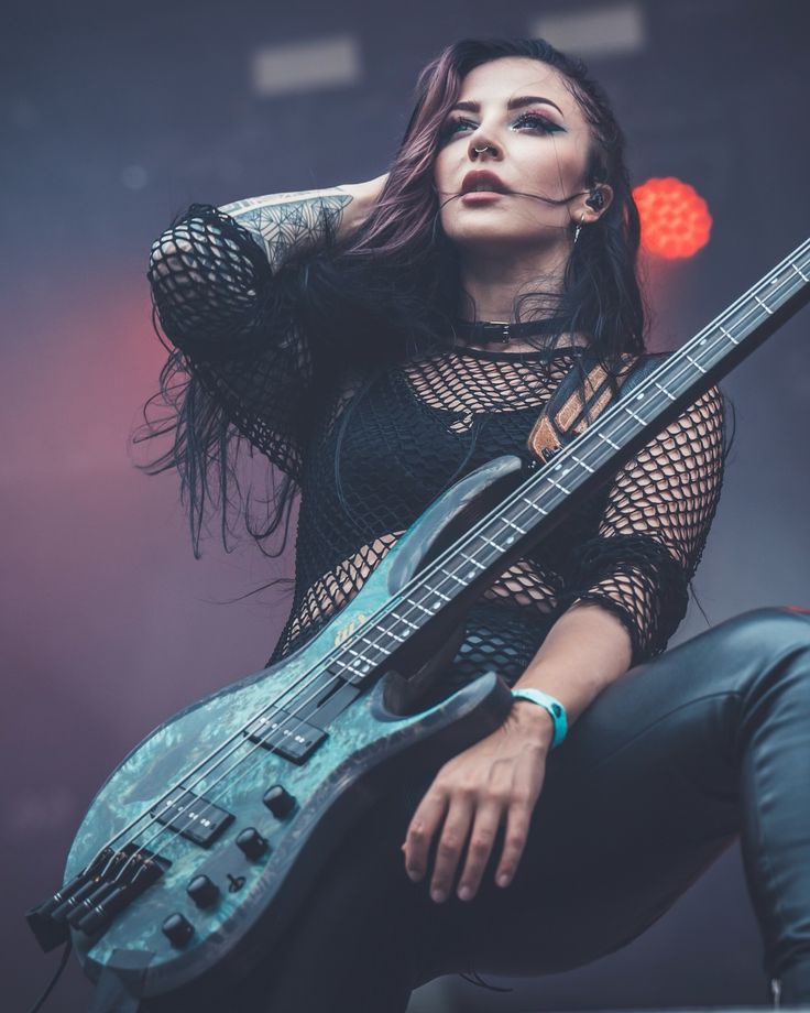 A touch of fishnet fashion: Alice Lane from Infected Rain.