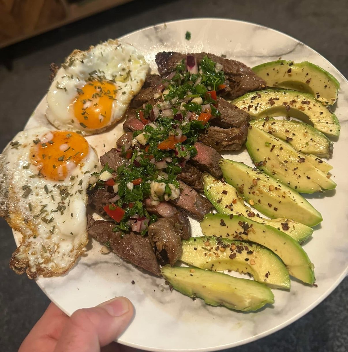 Indulging in a Delicious Lunch of Steak, Eggs, and Avocado