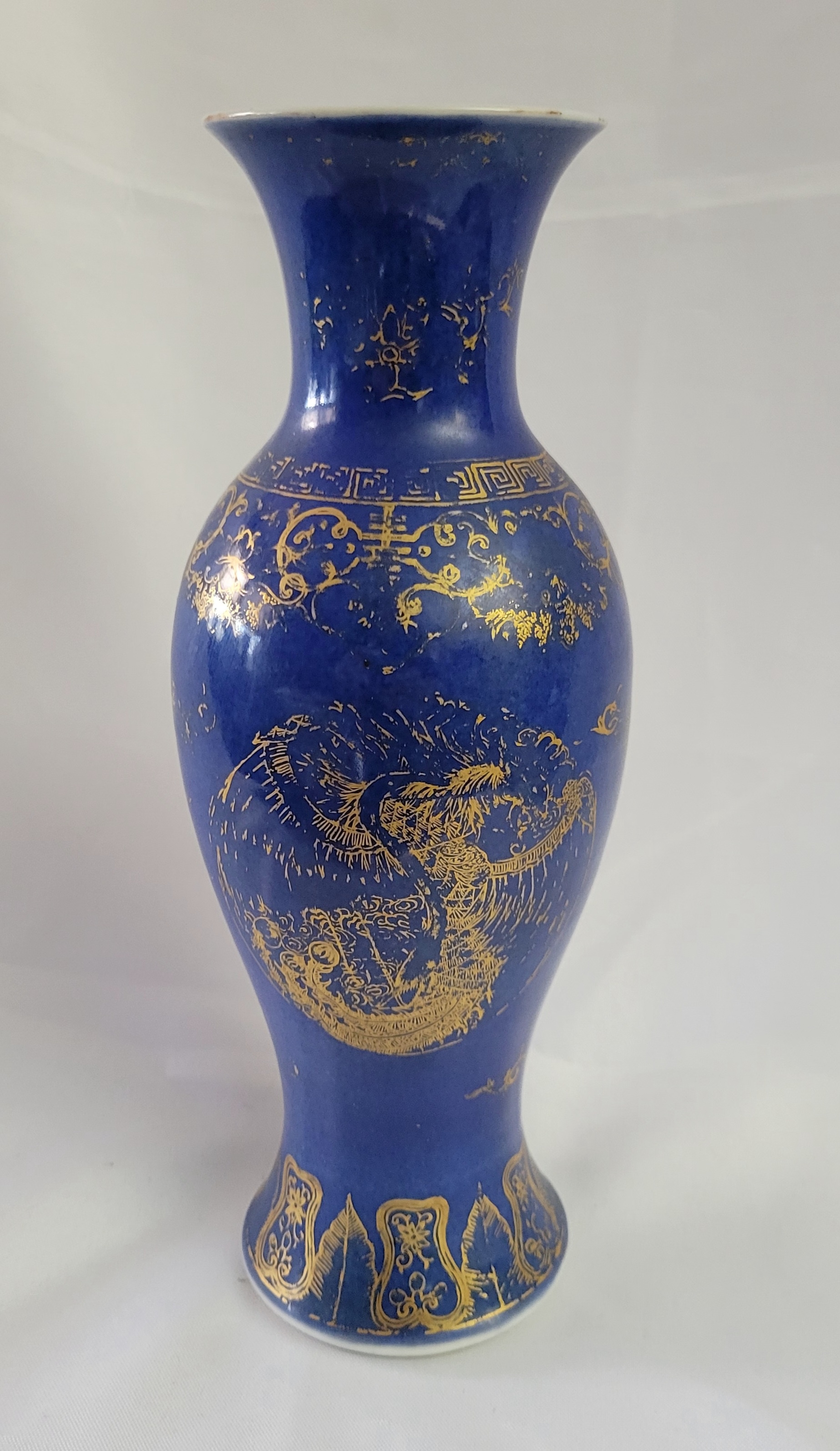 Stunning Chinese gilt on a cobalt glazed vase, standing at approximately 12 inches tall.