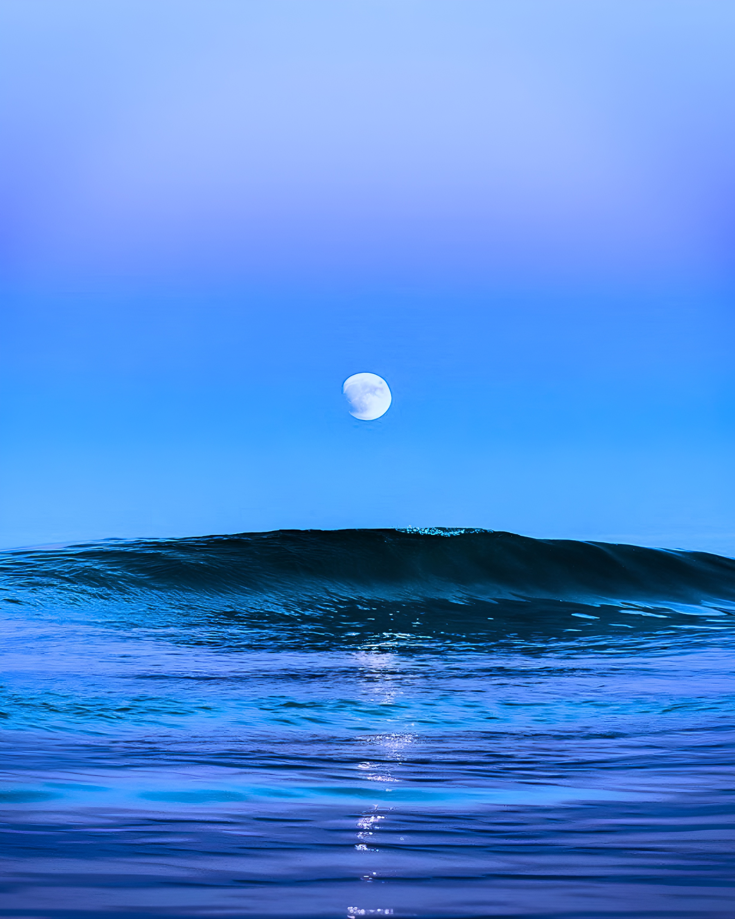 Breathtaking moonrise over the tranquil sea